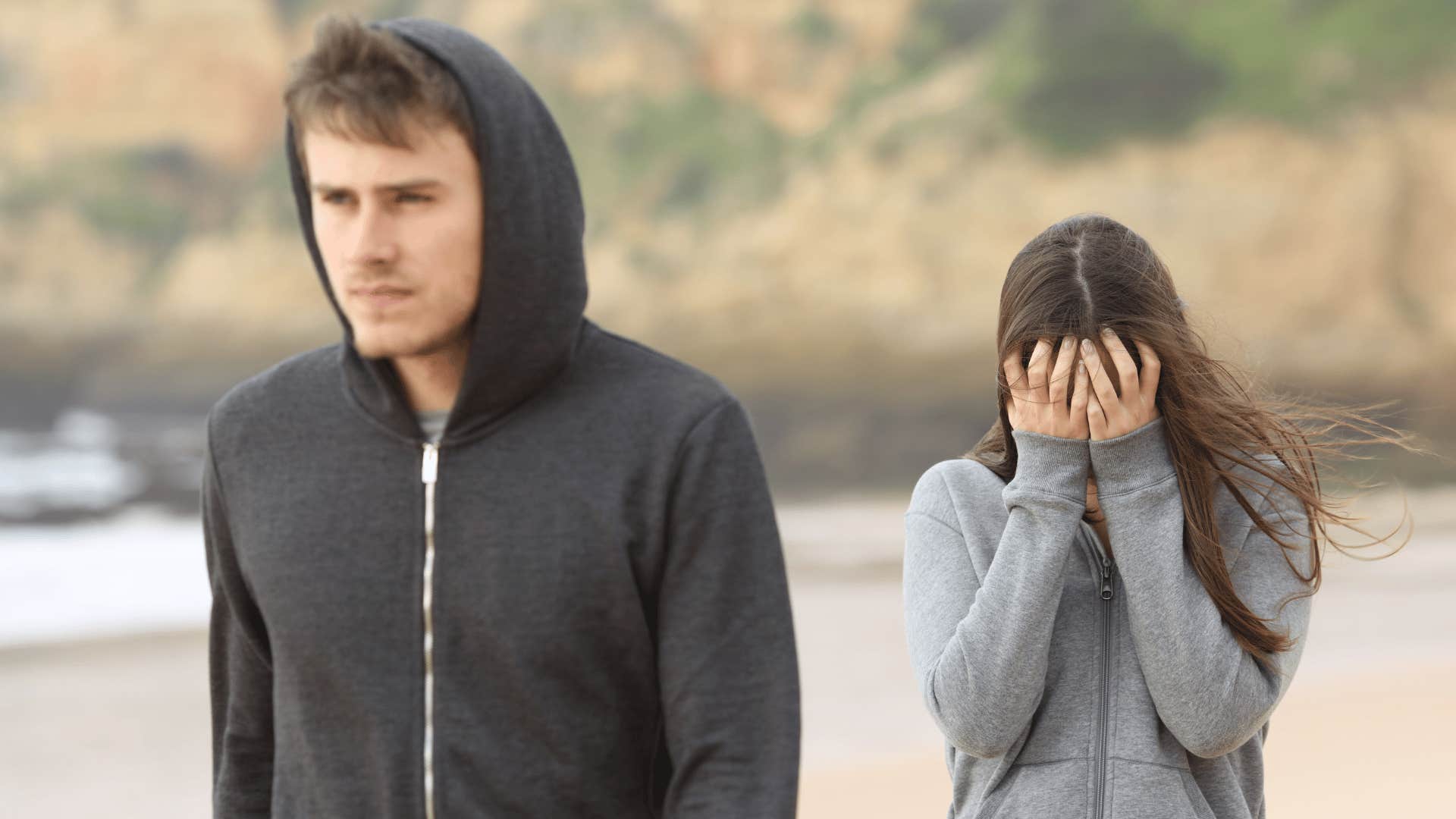 man walking away from a woman mid-conversation