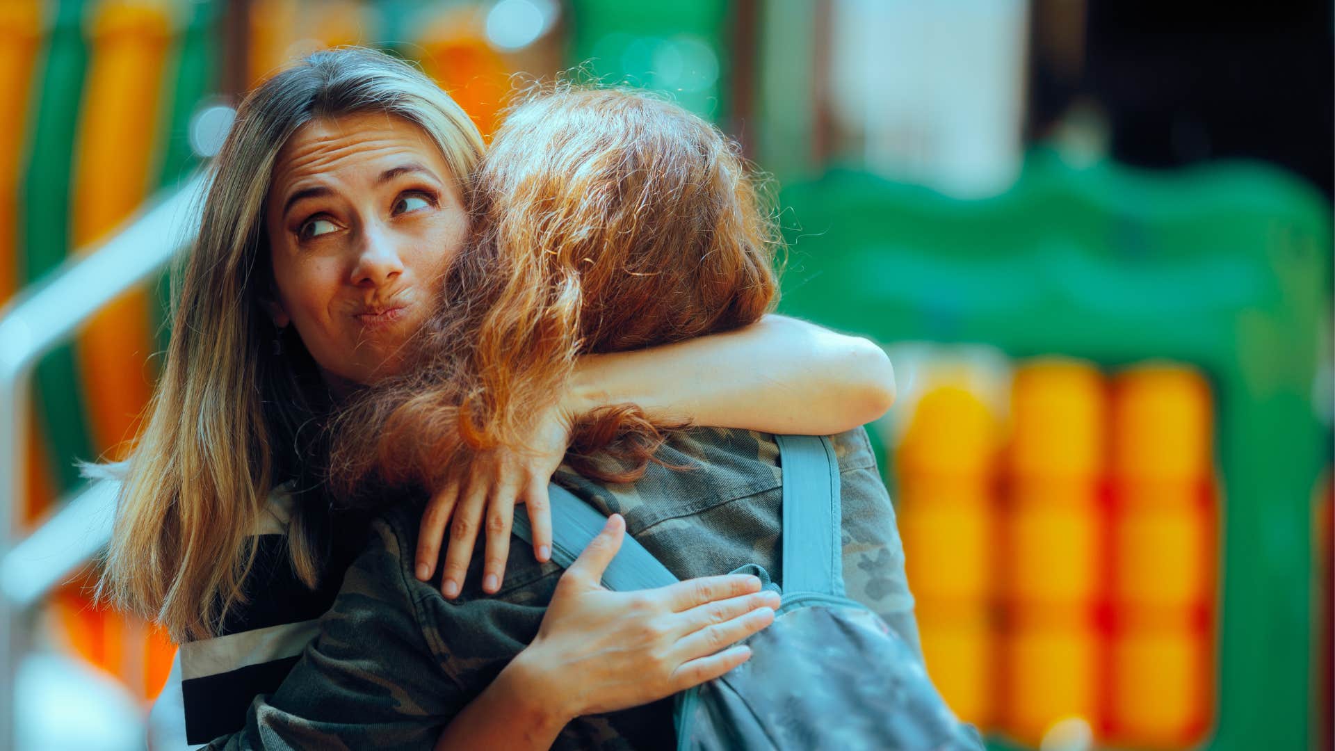 An opportunist hugging her friend