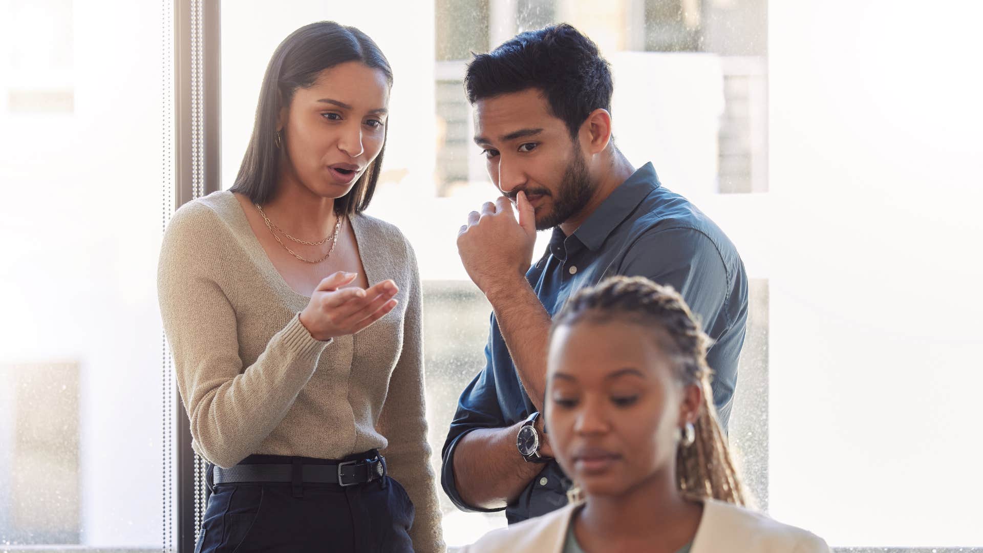 A woman minds her business and refuses to speak with her narrow-minded coworkers.