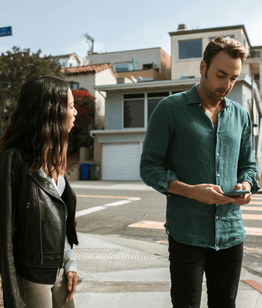 upset couple on street corner because it's time to end their relationship