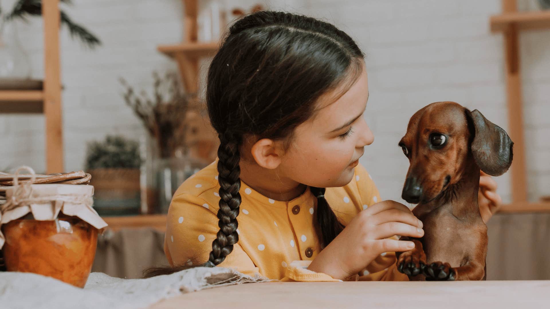 Young woman cooking a meal for her dog