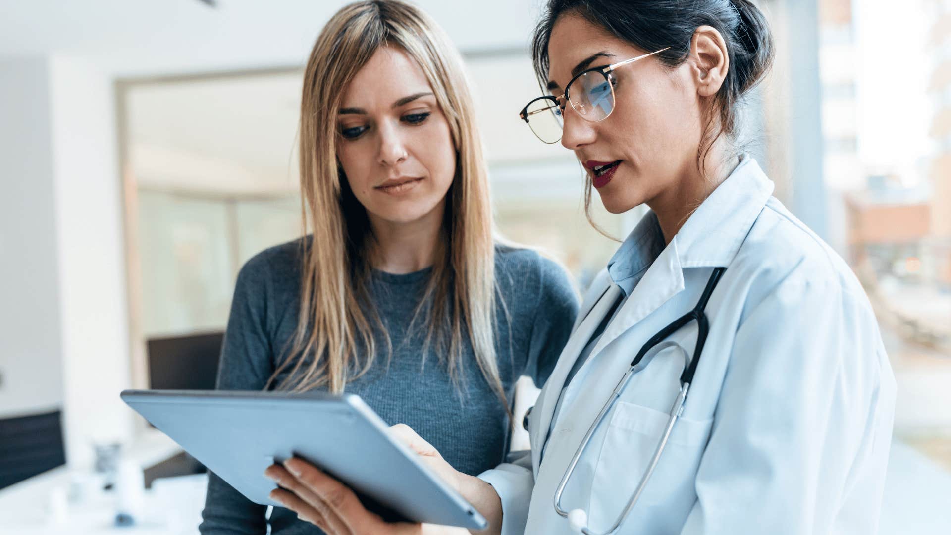 woman speaking with doctor about healthcare advances