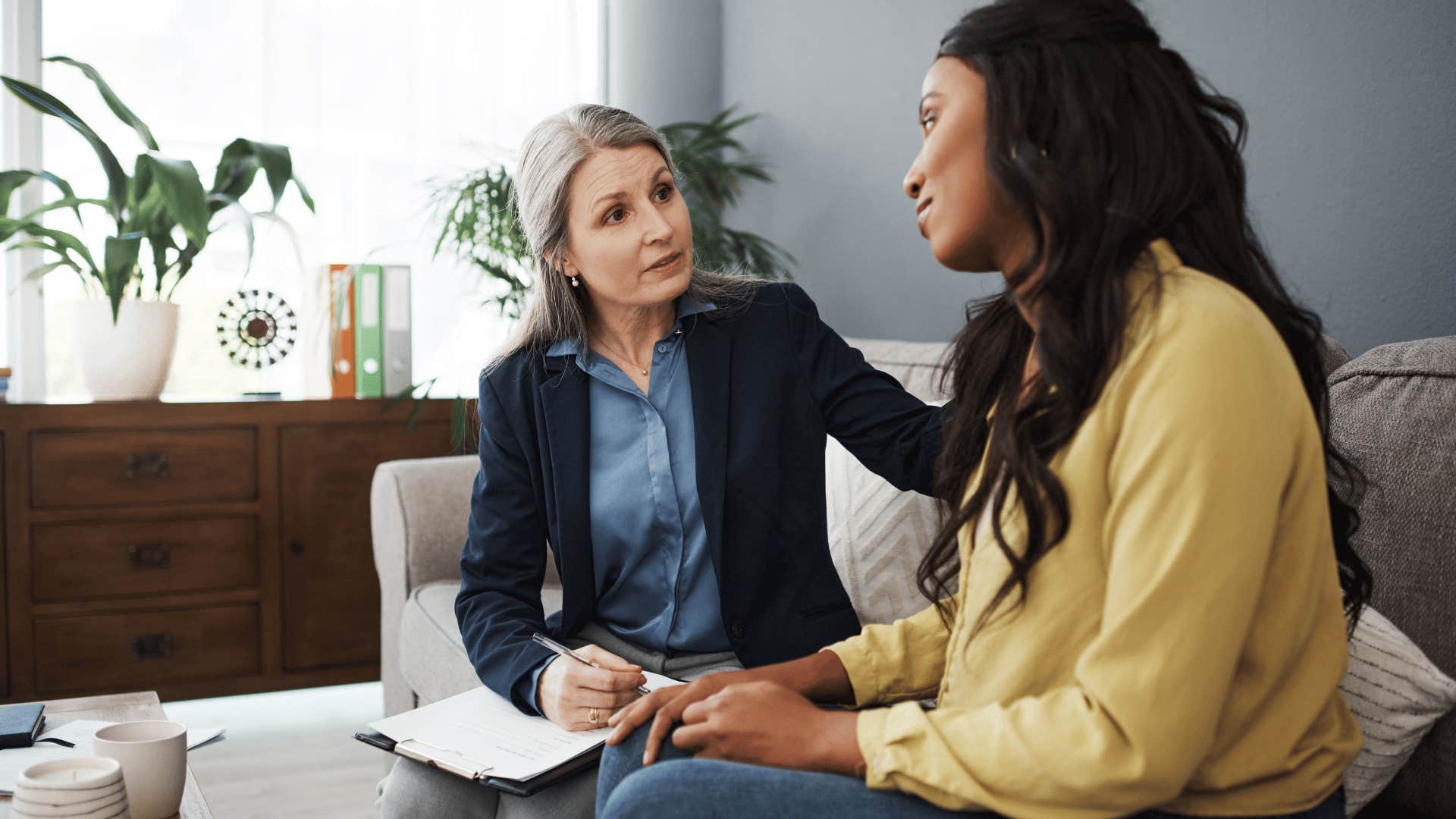 woman talking to therapist thanks to mental health access