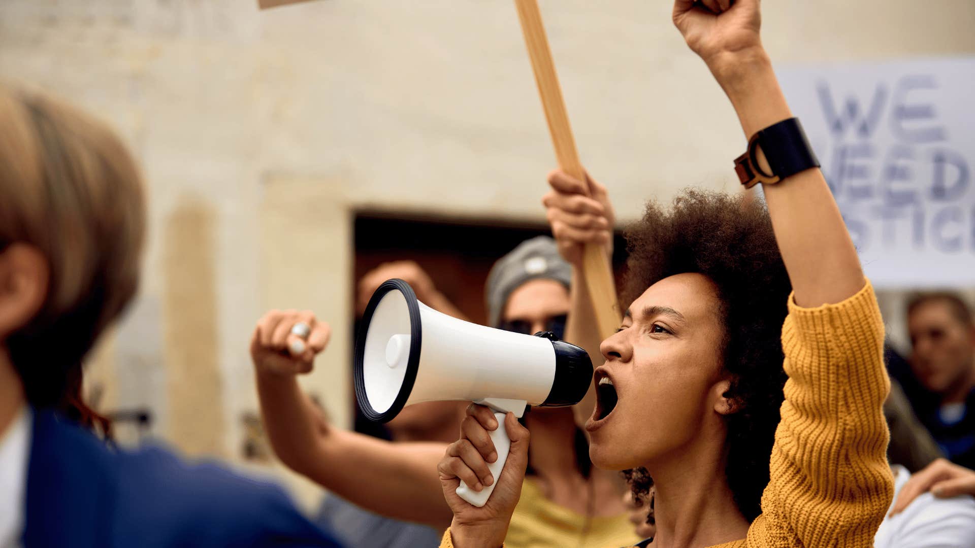 woman protesting along with others in a social movement
