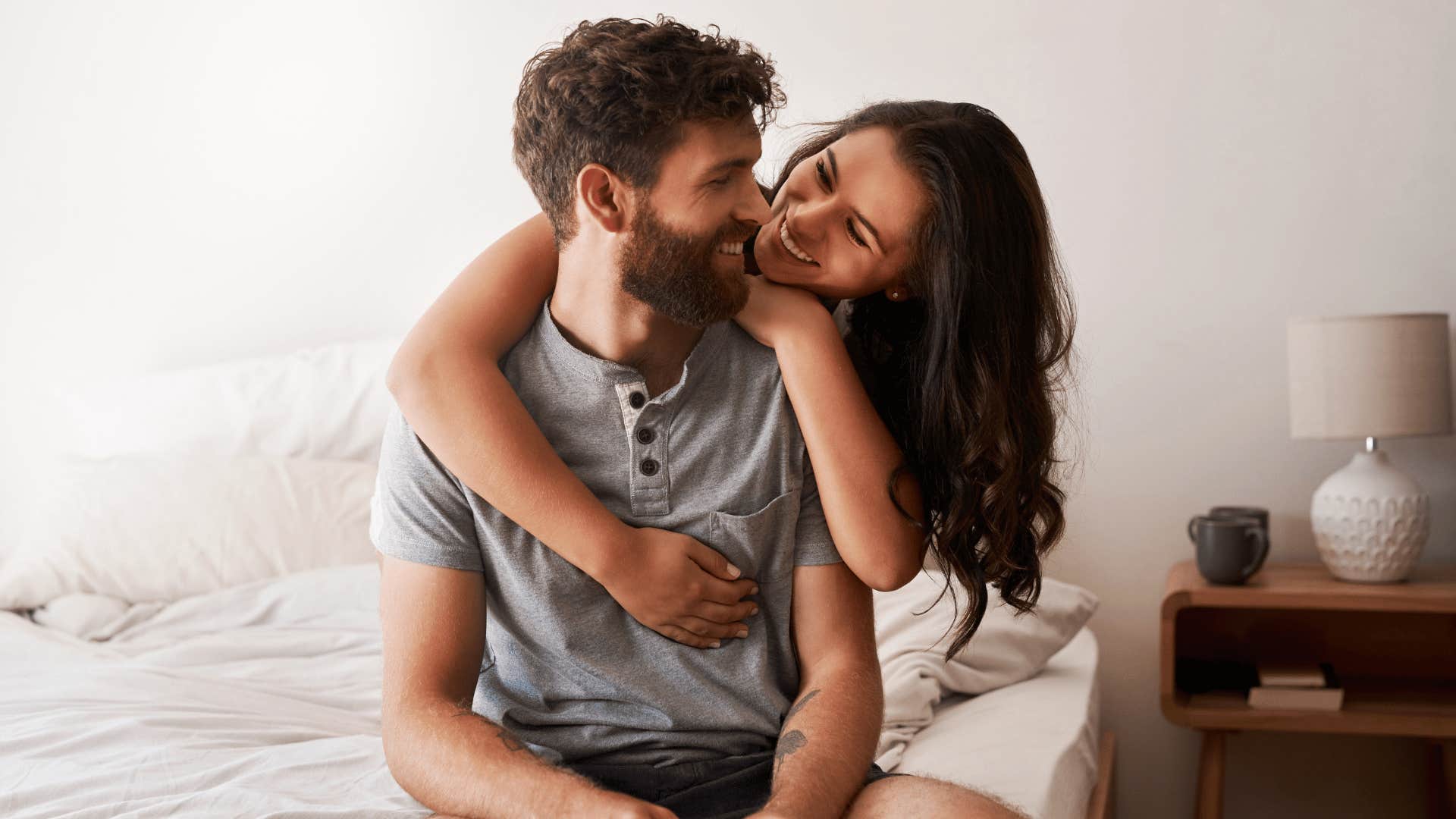 couple hugging in bed