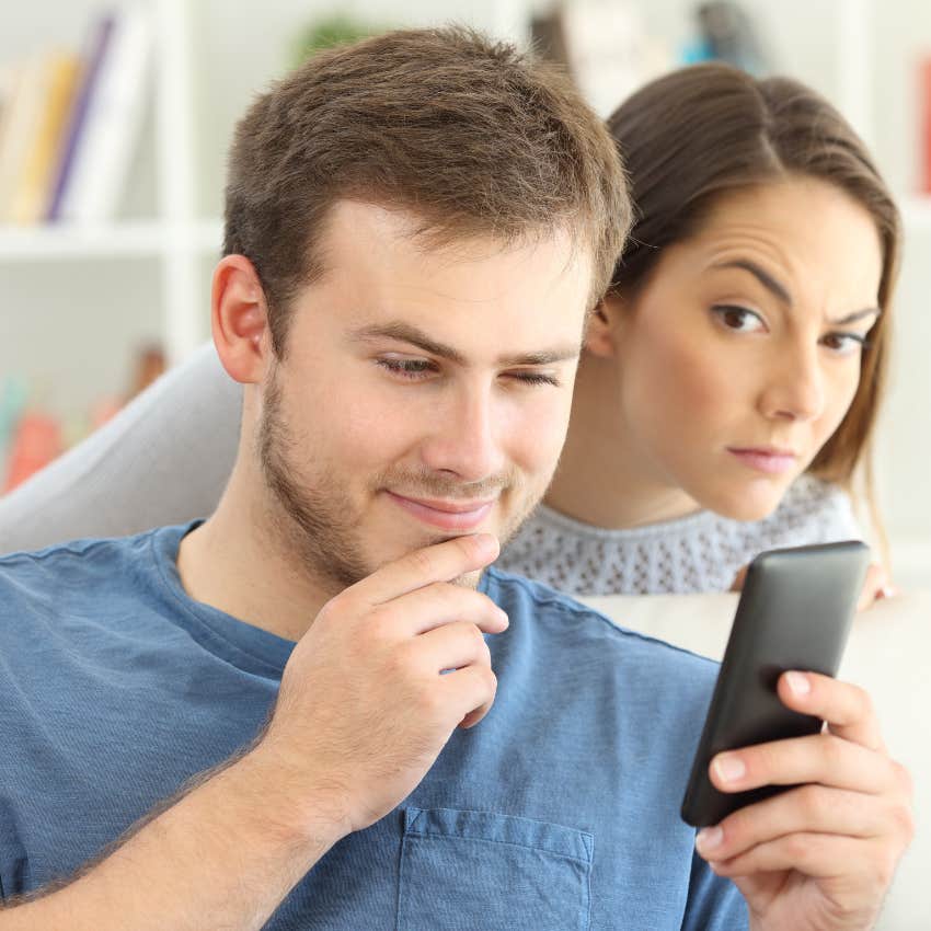 woman looking at man's phone because she has no close relationships