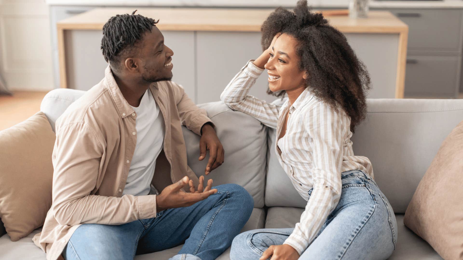 couple talking on couch