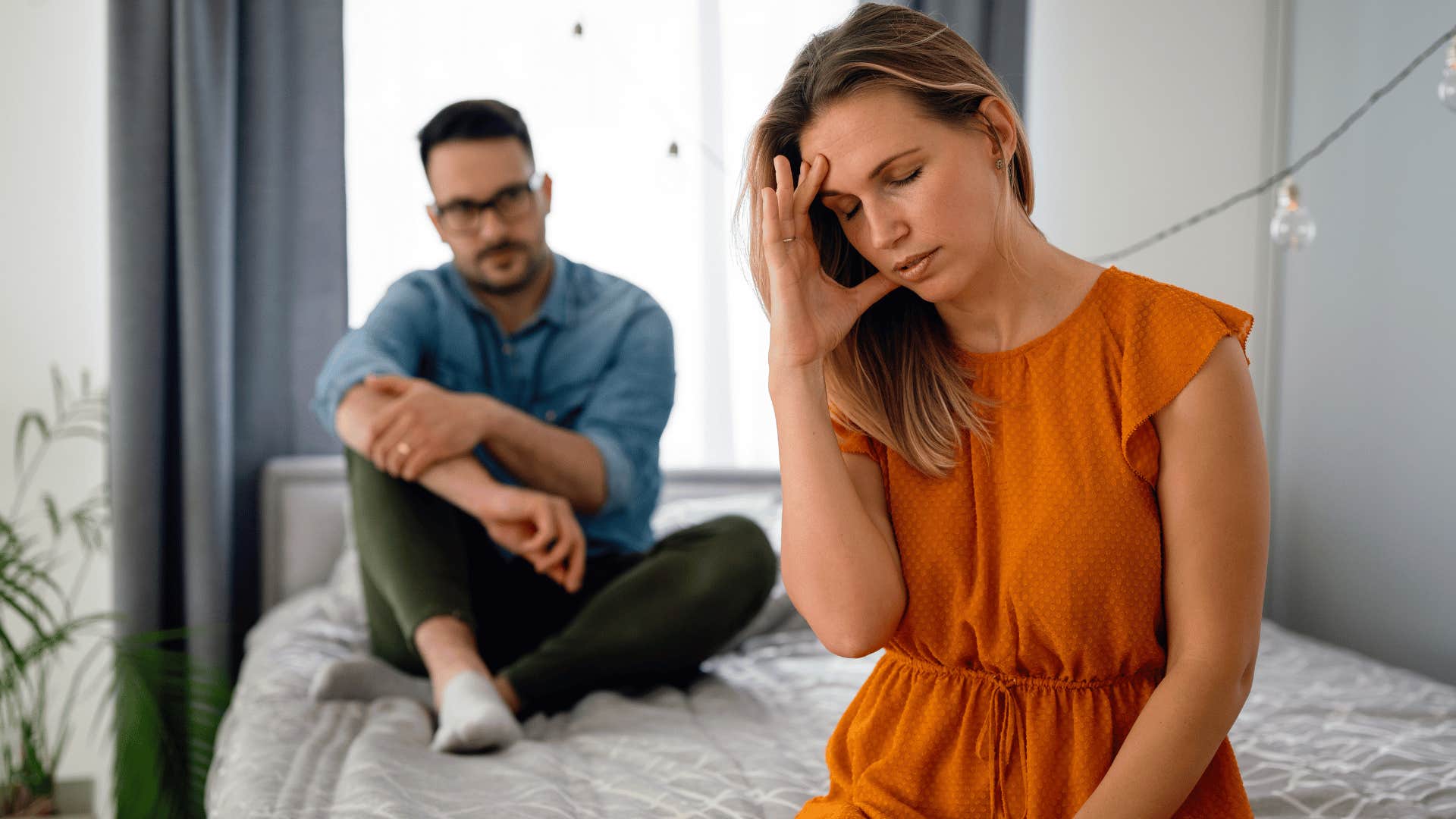 annoyed woman ignoring sad husband