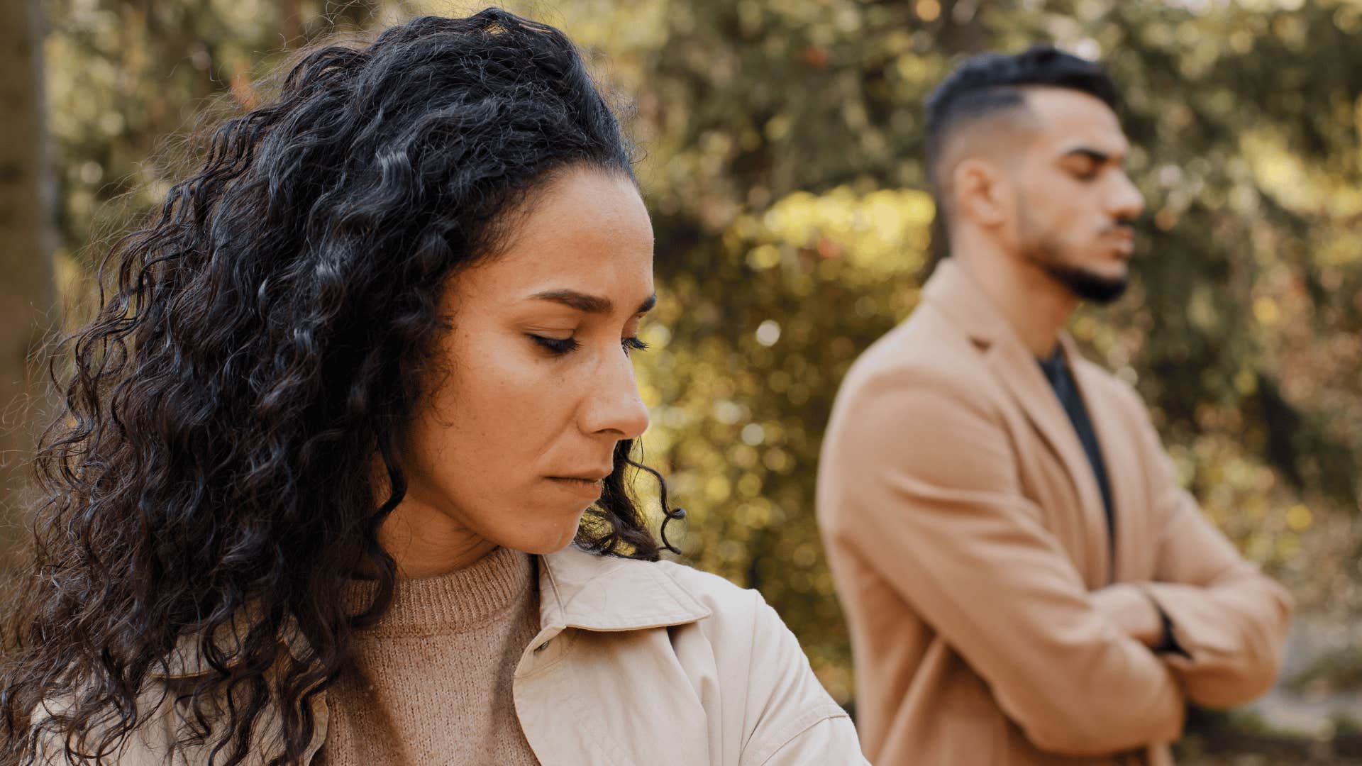 woman turned away from defensive husband