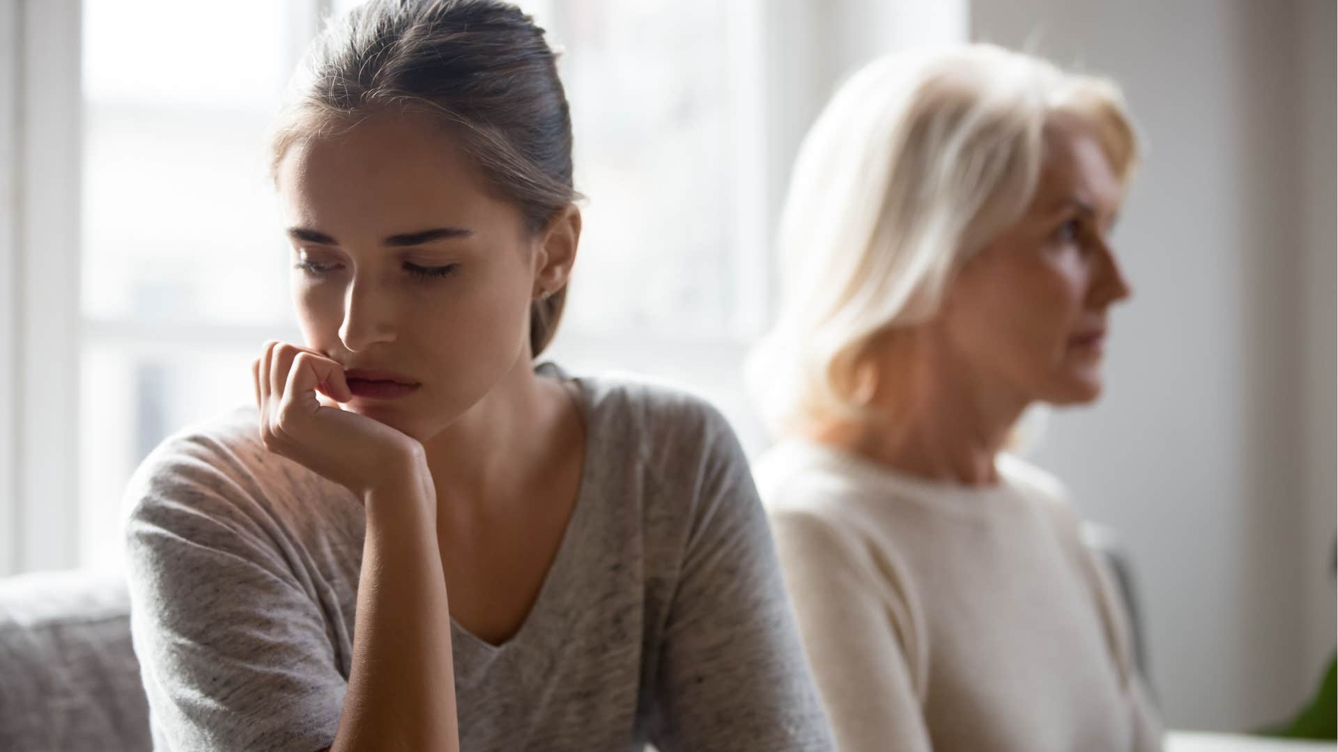 adult woman emotionally withdrawing from disrespectful mom