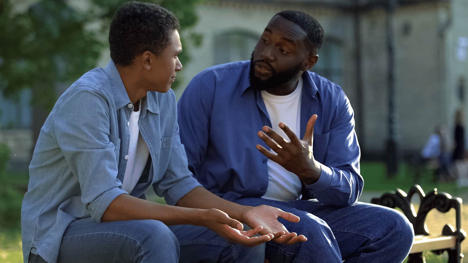 Upset father refusing to talk about childhood trauma with his son.