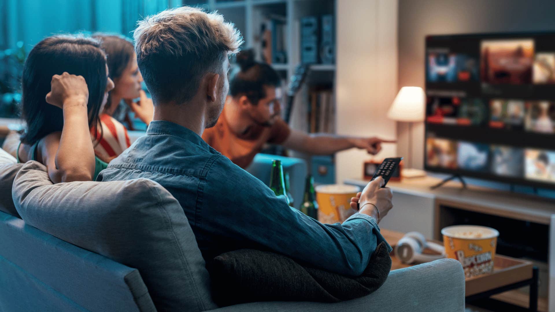 group of friends scrolling through streaming service app