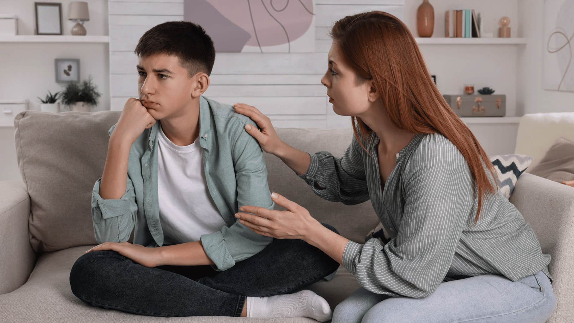 mom comforting her son on the couch and telling him to focus on what he can control