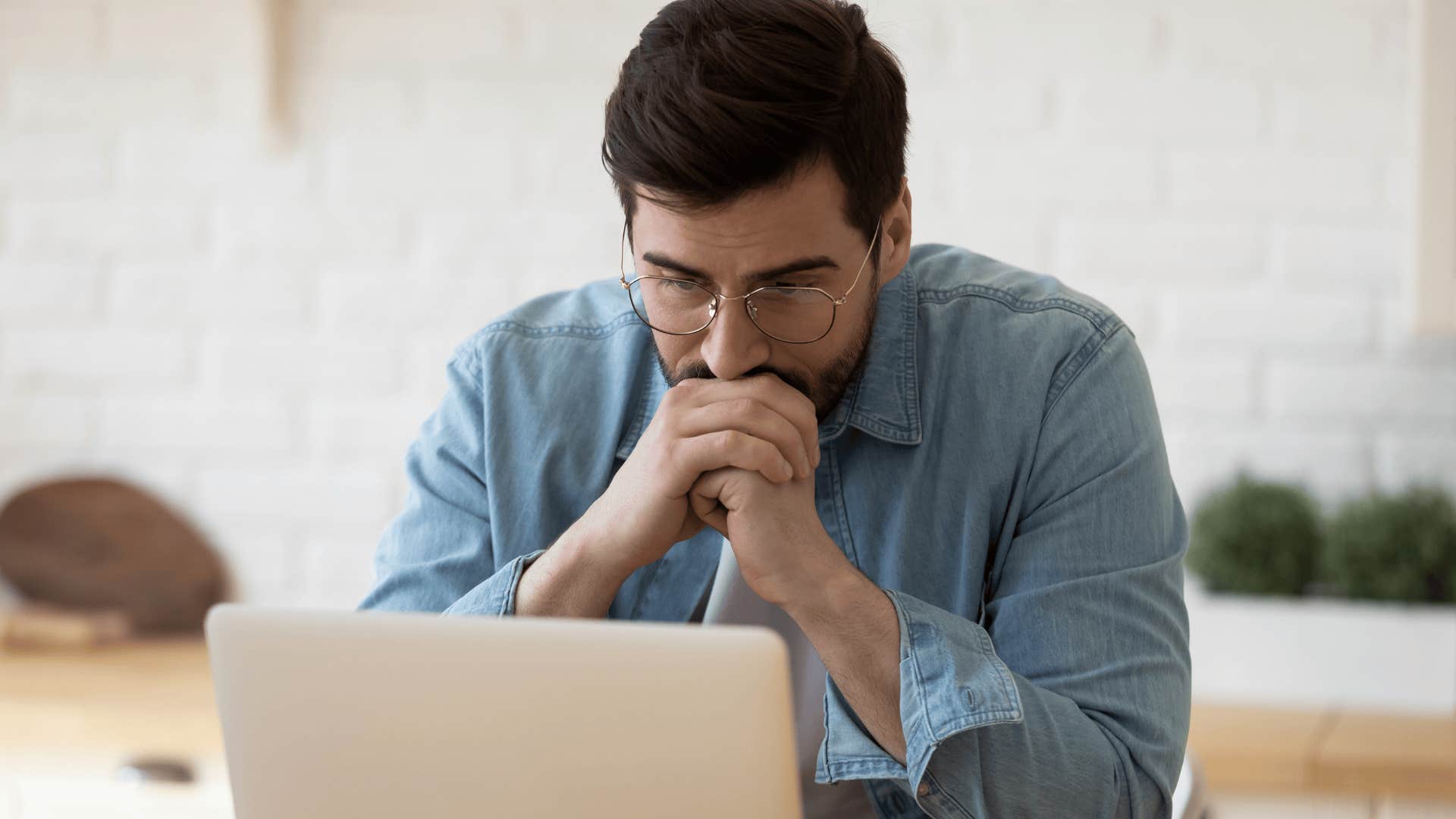 young man thinking looking very focused