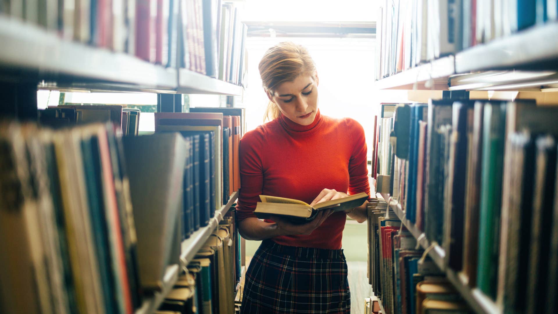 curious woman reading books to be a winner