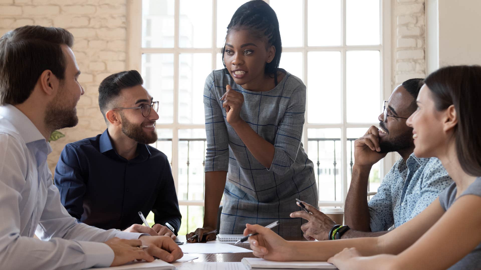 woman in business meeting with strong work ethic