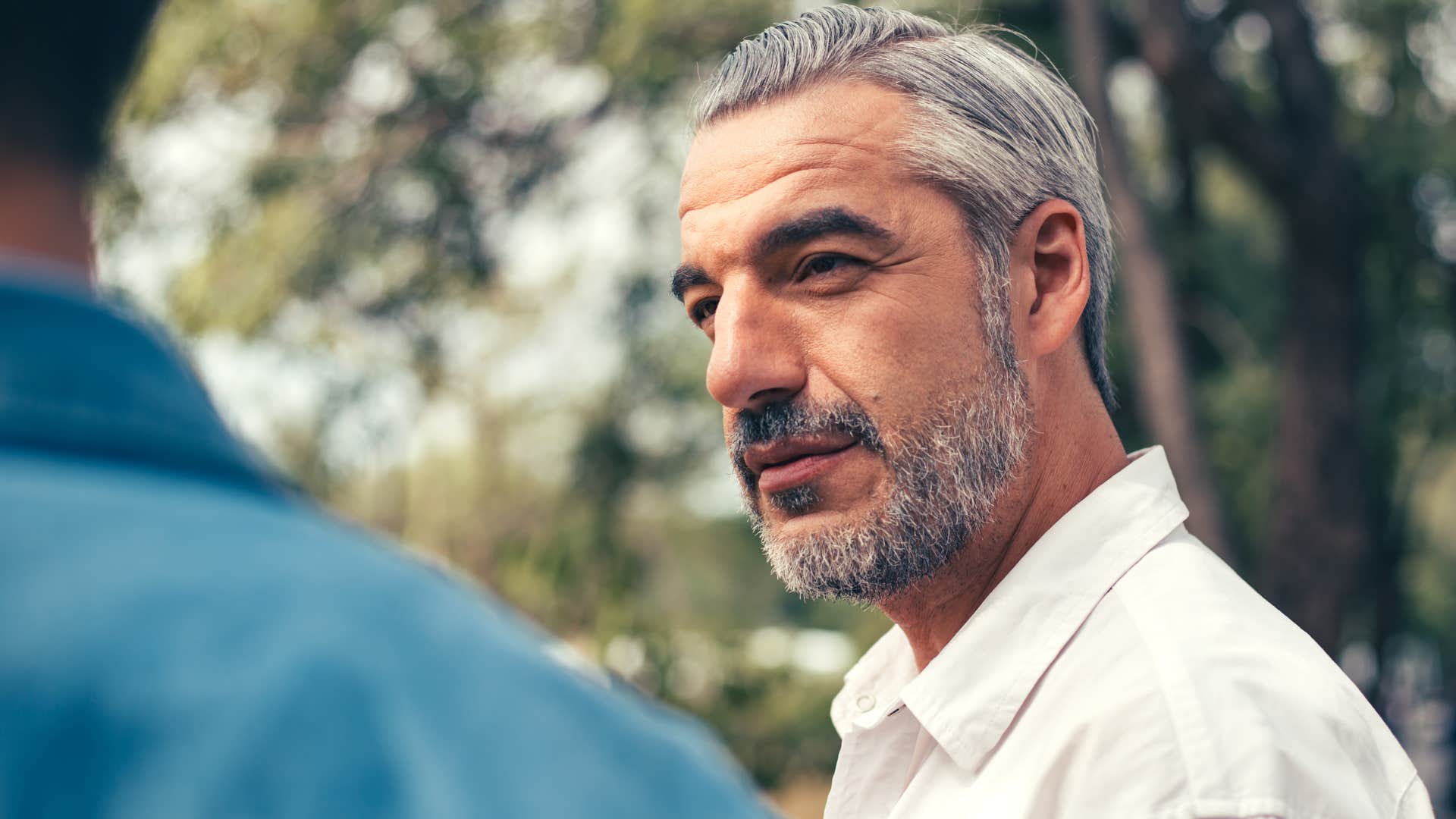 man listening in conversation with intent to blackmail