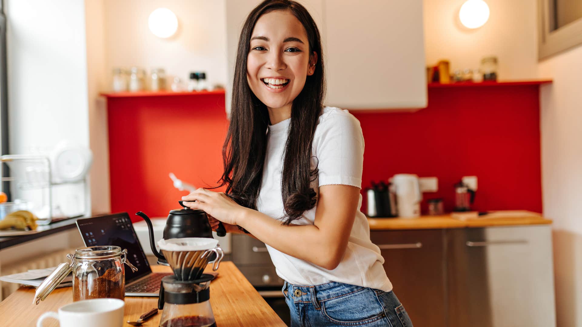 woman making coffee at home because it's cheaper