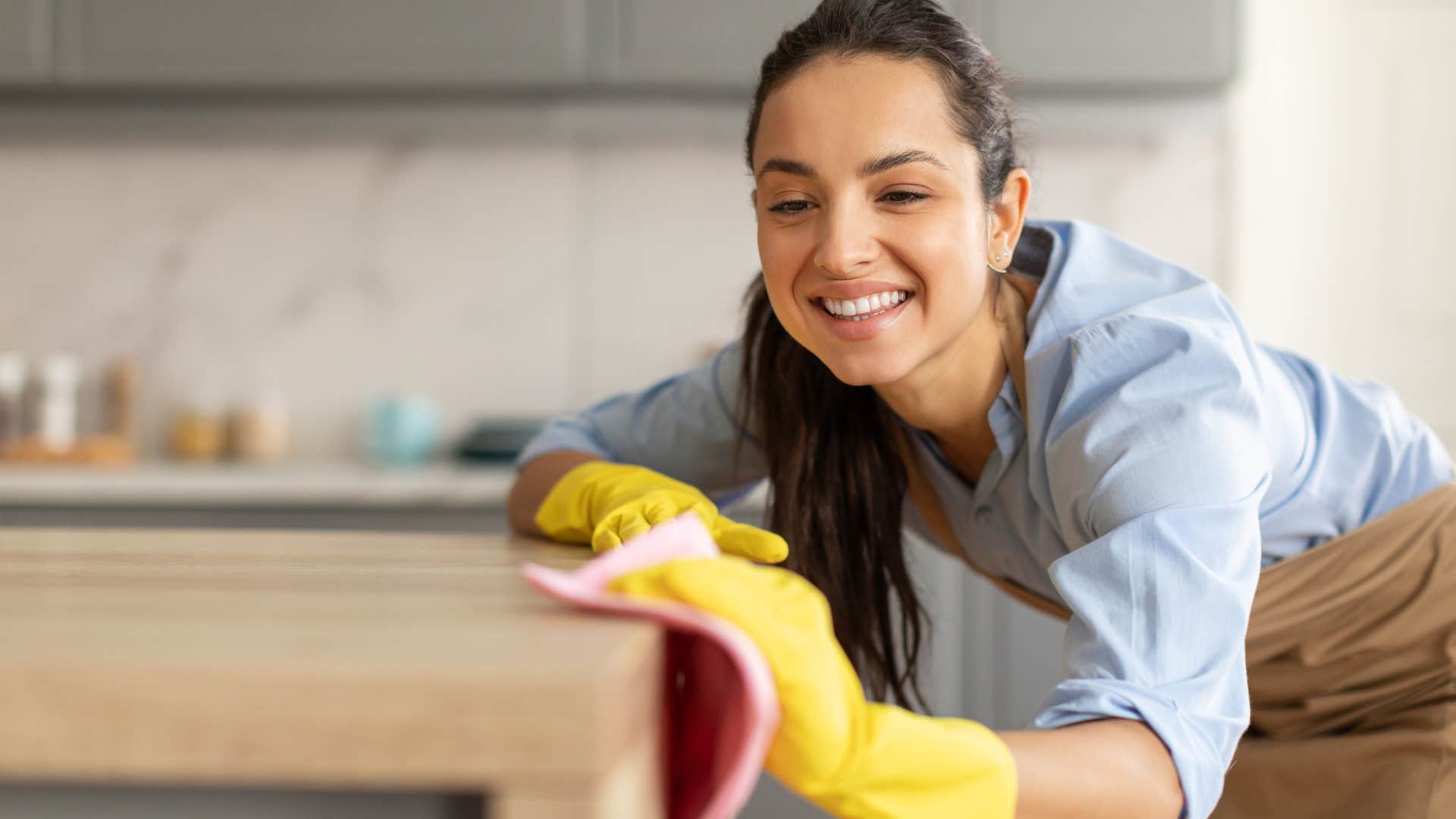 woman who is cleaning because she has more time to be productive