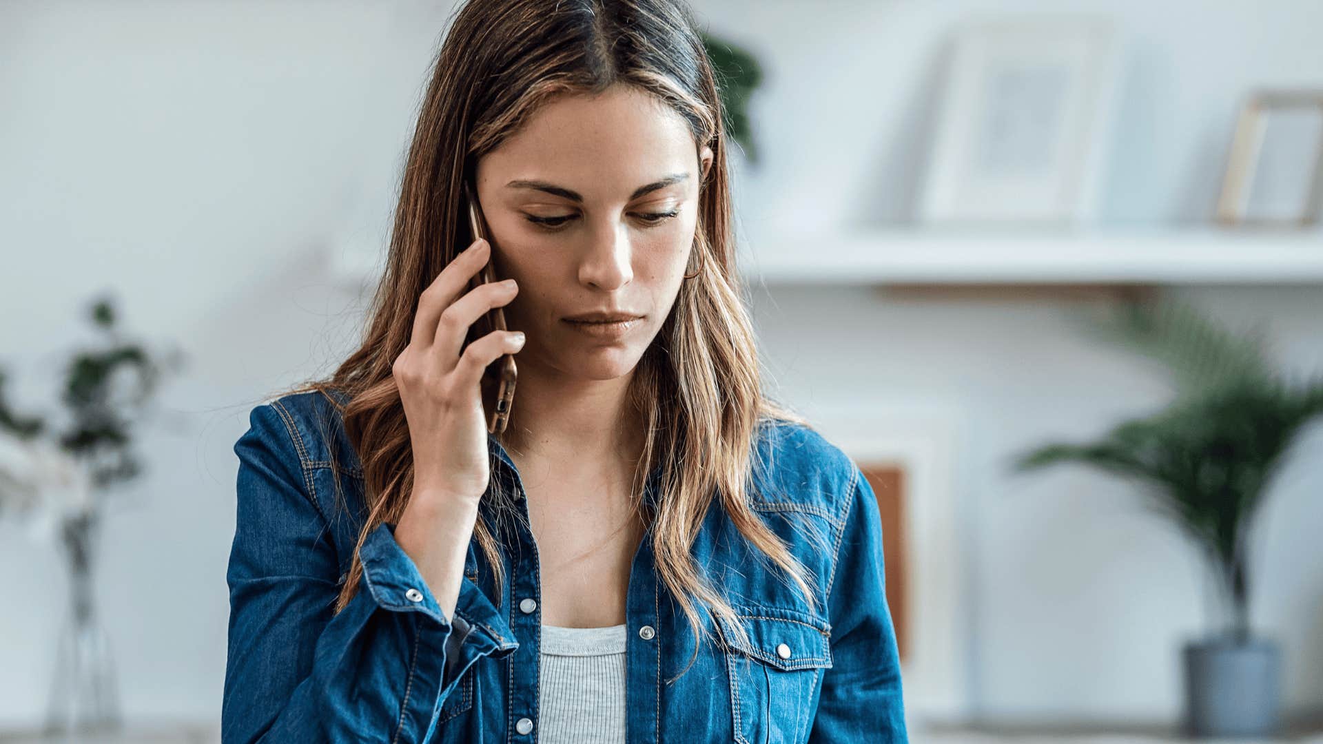serious woman talking on her phone setting boundaries