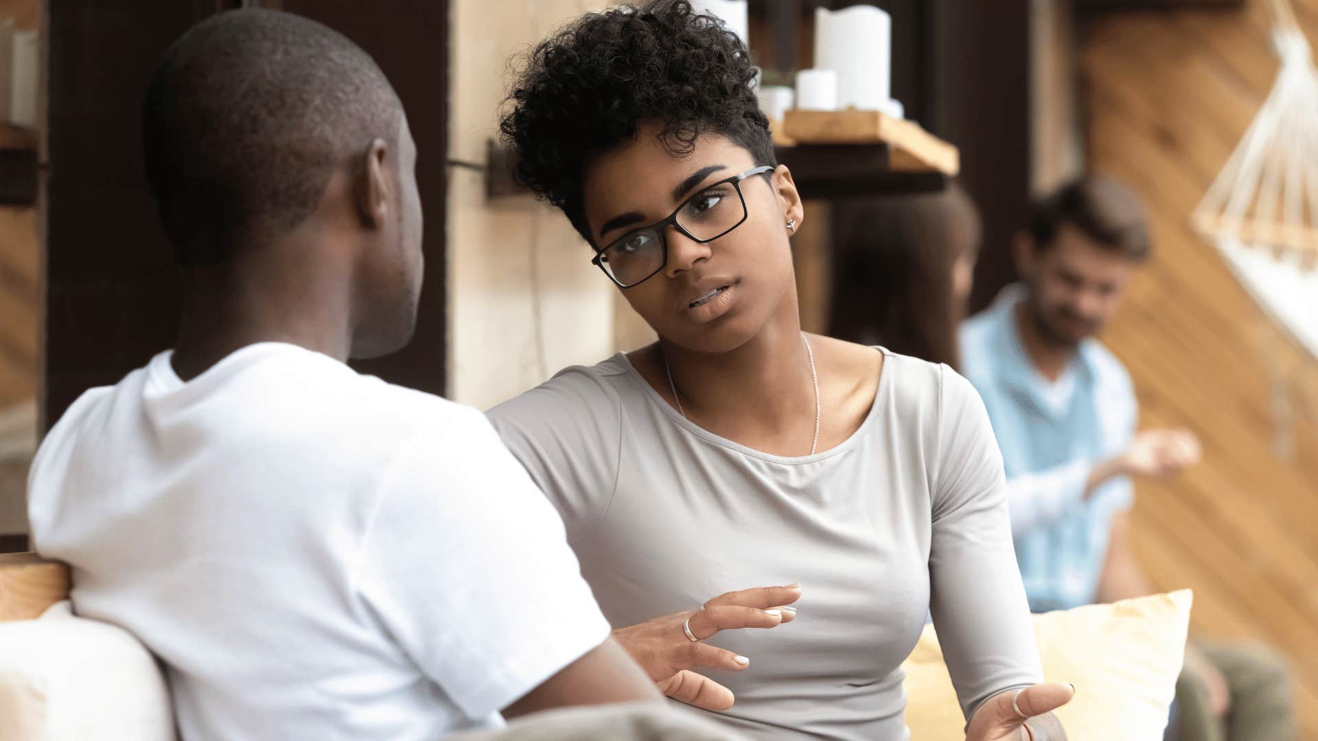 woman in gray shirt and glasses explaining why man's actions were a big deal to her
