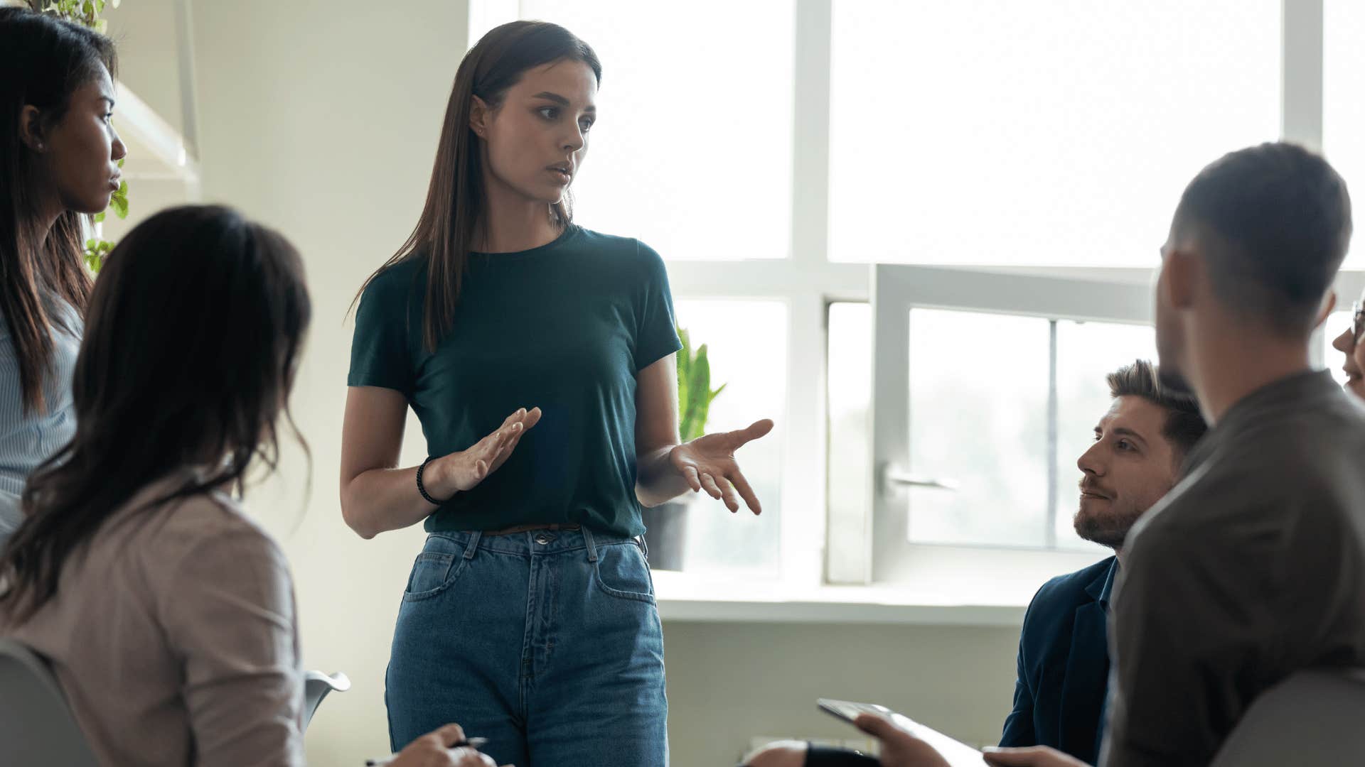 woman whose seeing things differently trying to explain her perspective to her coworkers