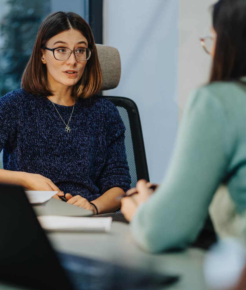 A woman tells her co-worker that she is not confused and the co-worker is just not being direct.