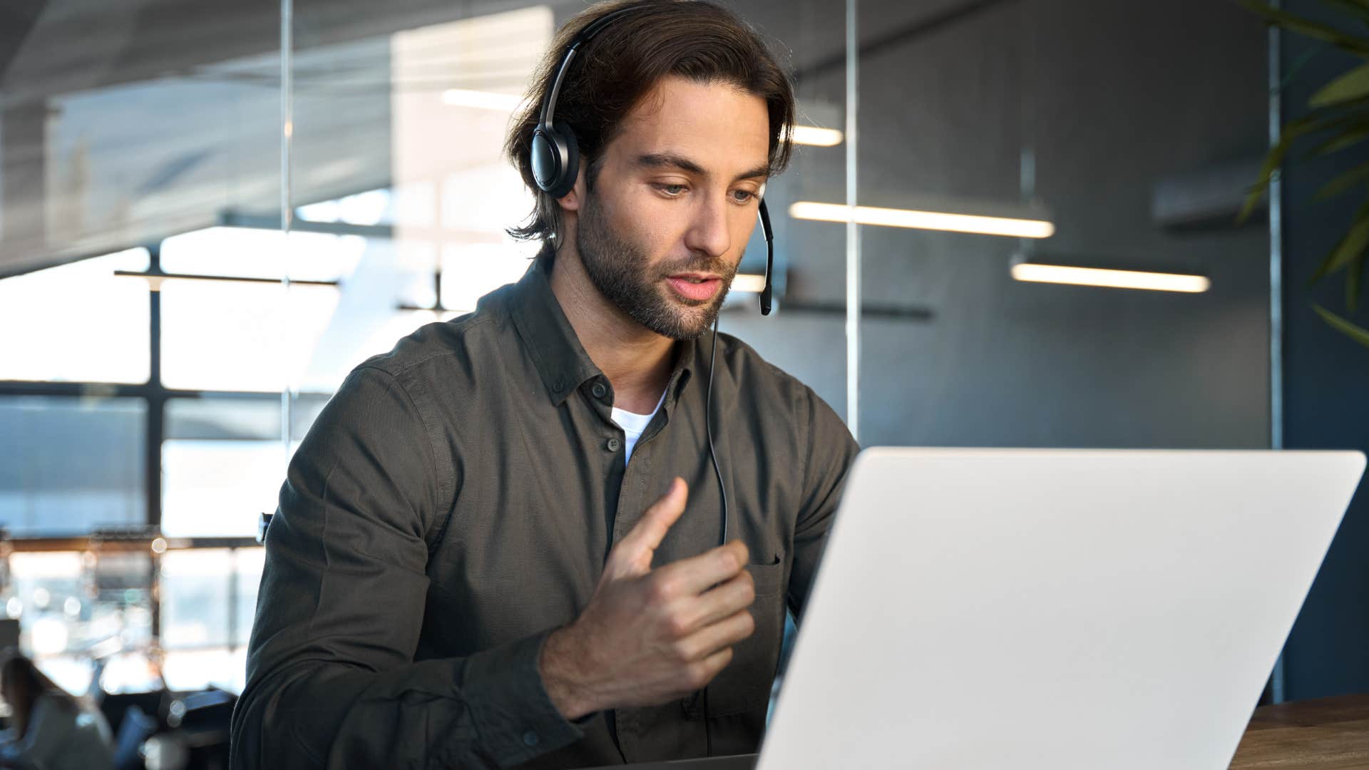 man on headset asking how he can support a person
