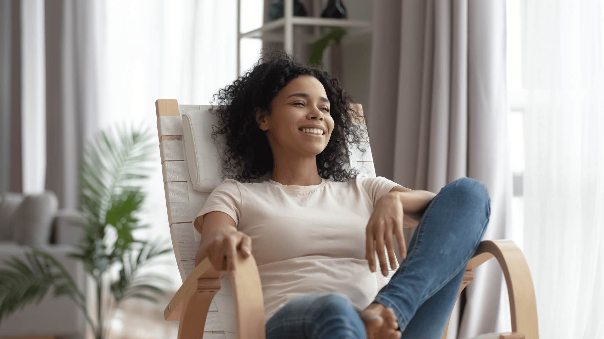woman smiling on chair