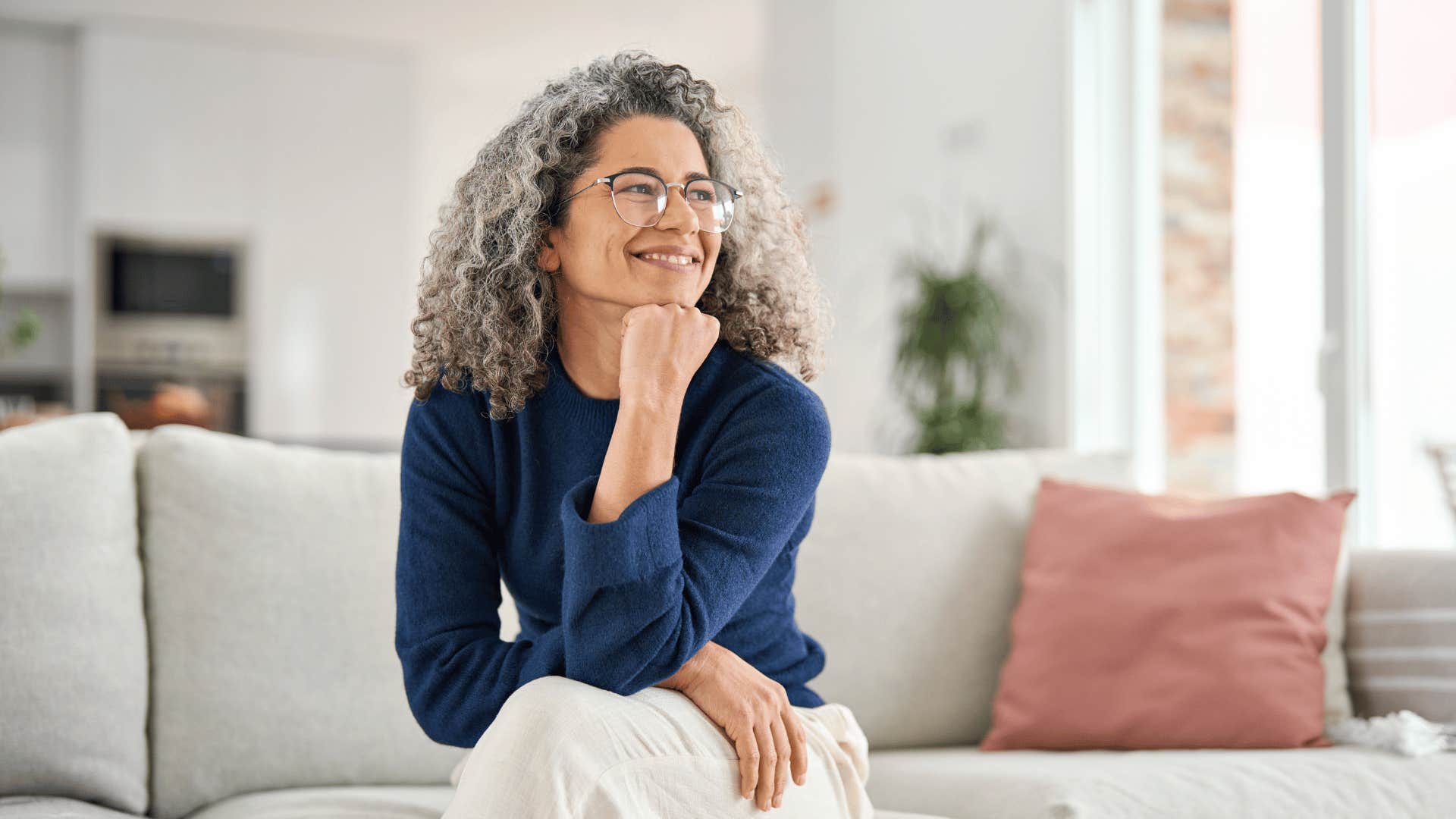 older woman smiling and enjoying being alone