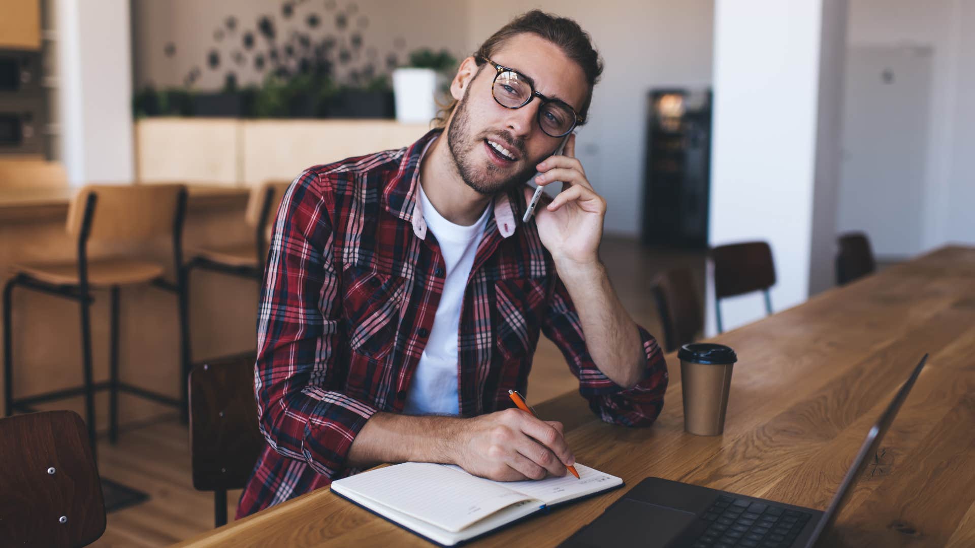 man on the phone asking will the event only be there, or will we be traveling throughout the day as he writes something down