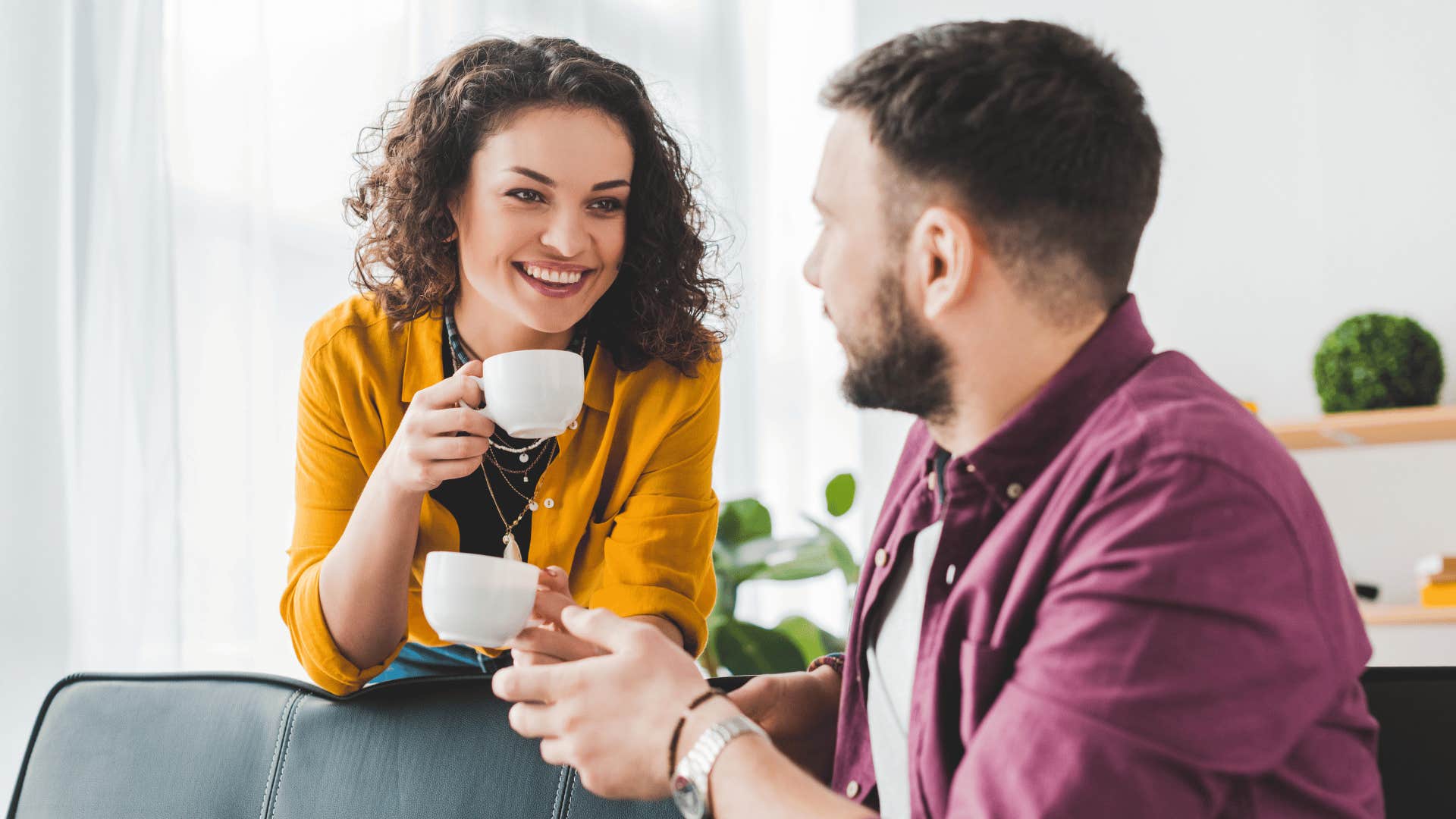 woman getting back out there and drinking coffee with man