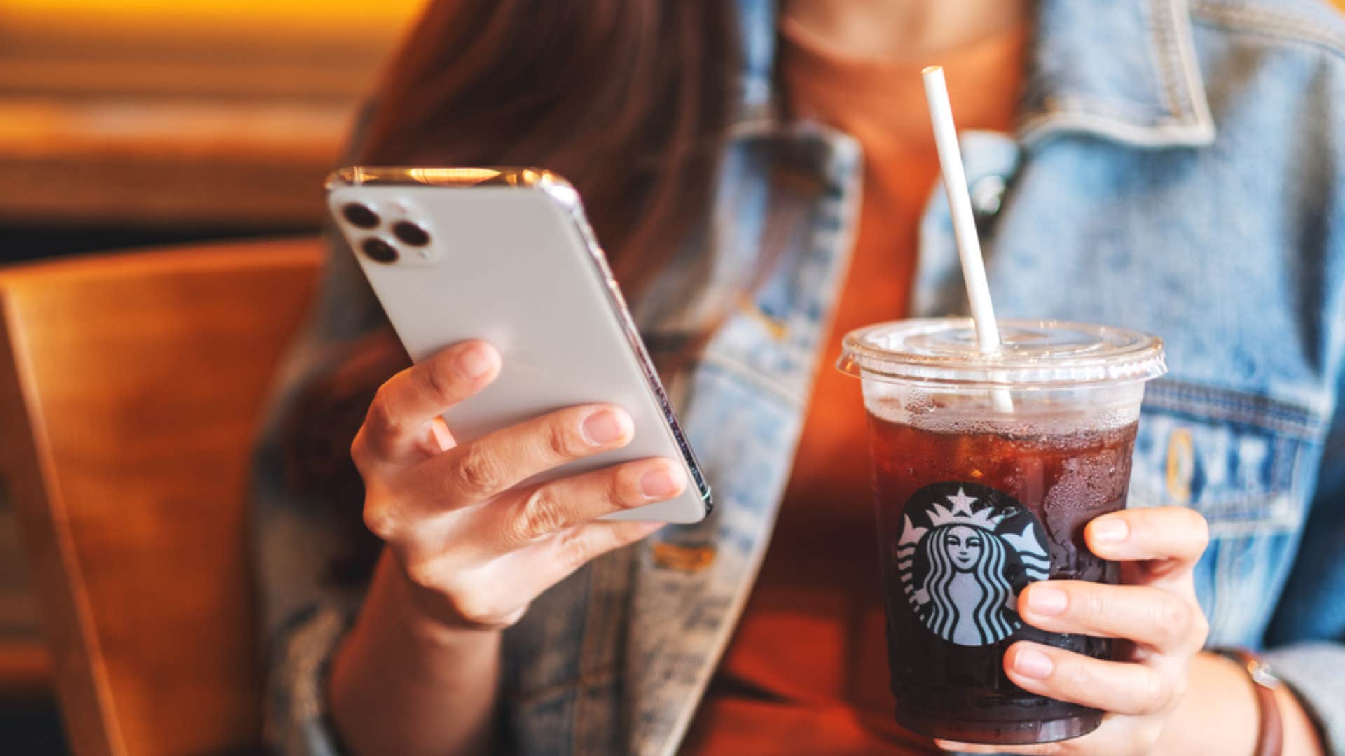 woman using starbucks loyalty program for purchase points 
