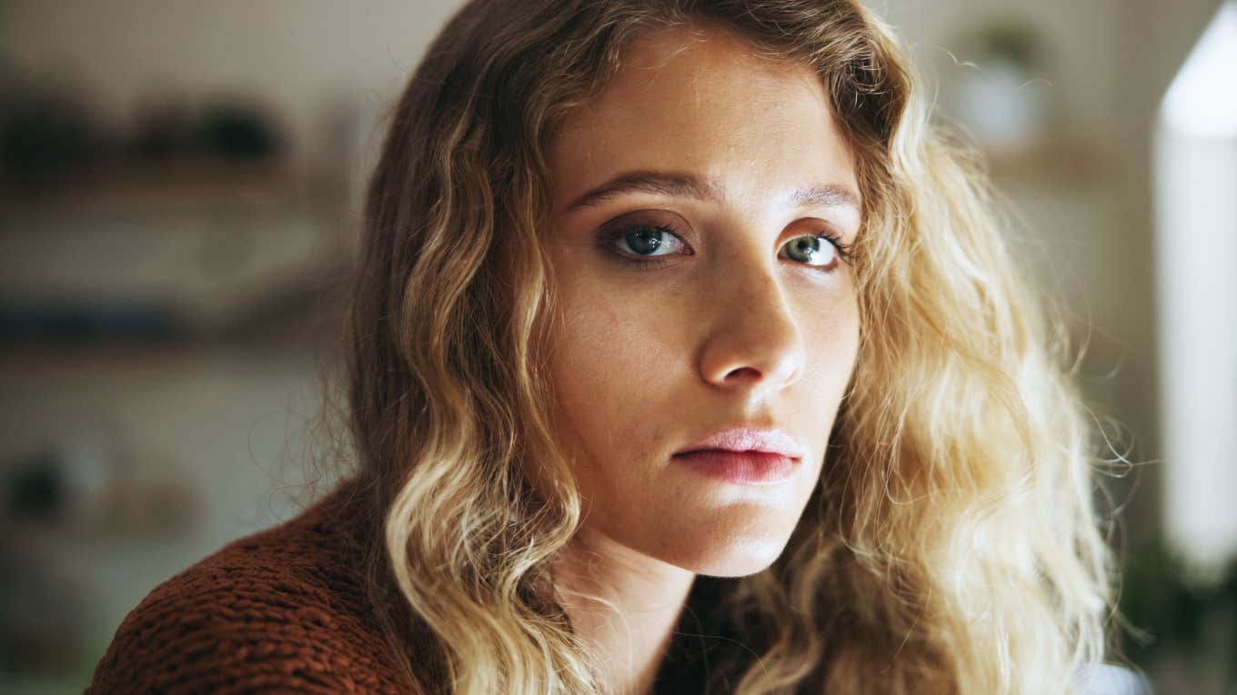 sad woman thinking about bad childhood experiences