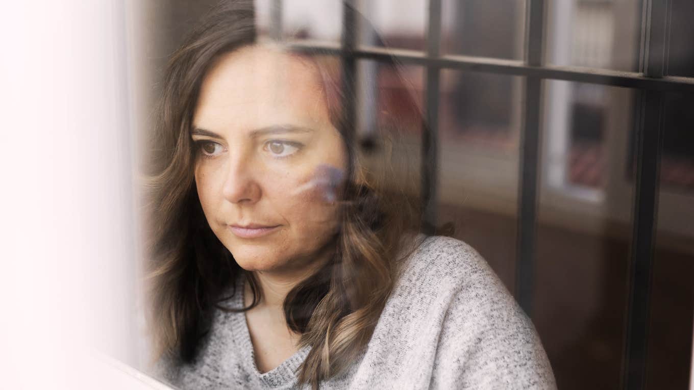 Work Colleague’s Death Taught Me About Grief, Friendship, And Showing Up woman grieving about coworker friend's death