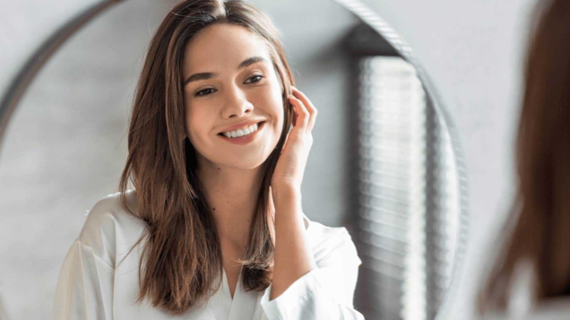 confident woman telling herself she matters 