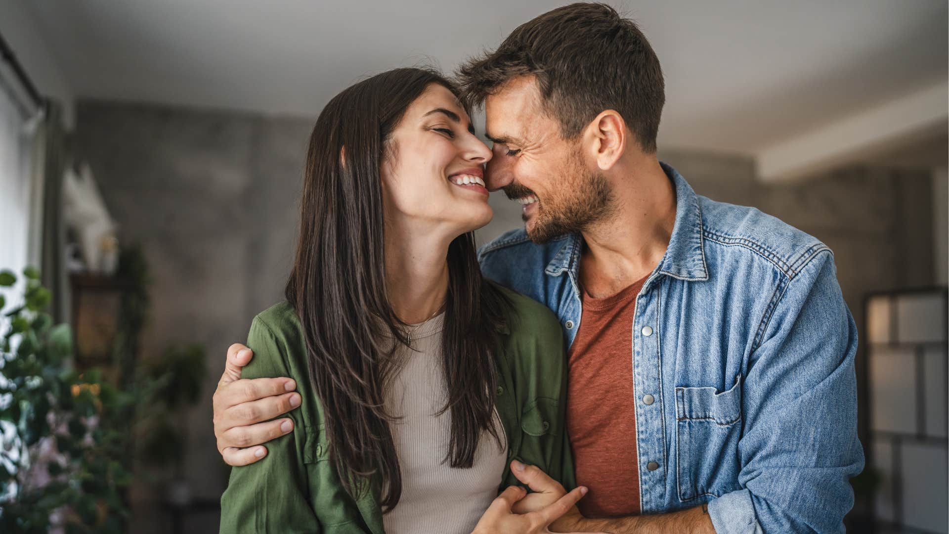 couple who greet each other still hold hands at the grocery store