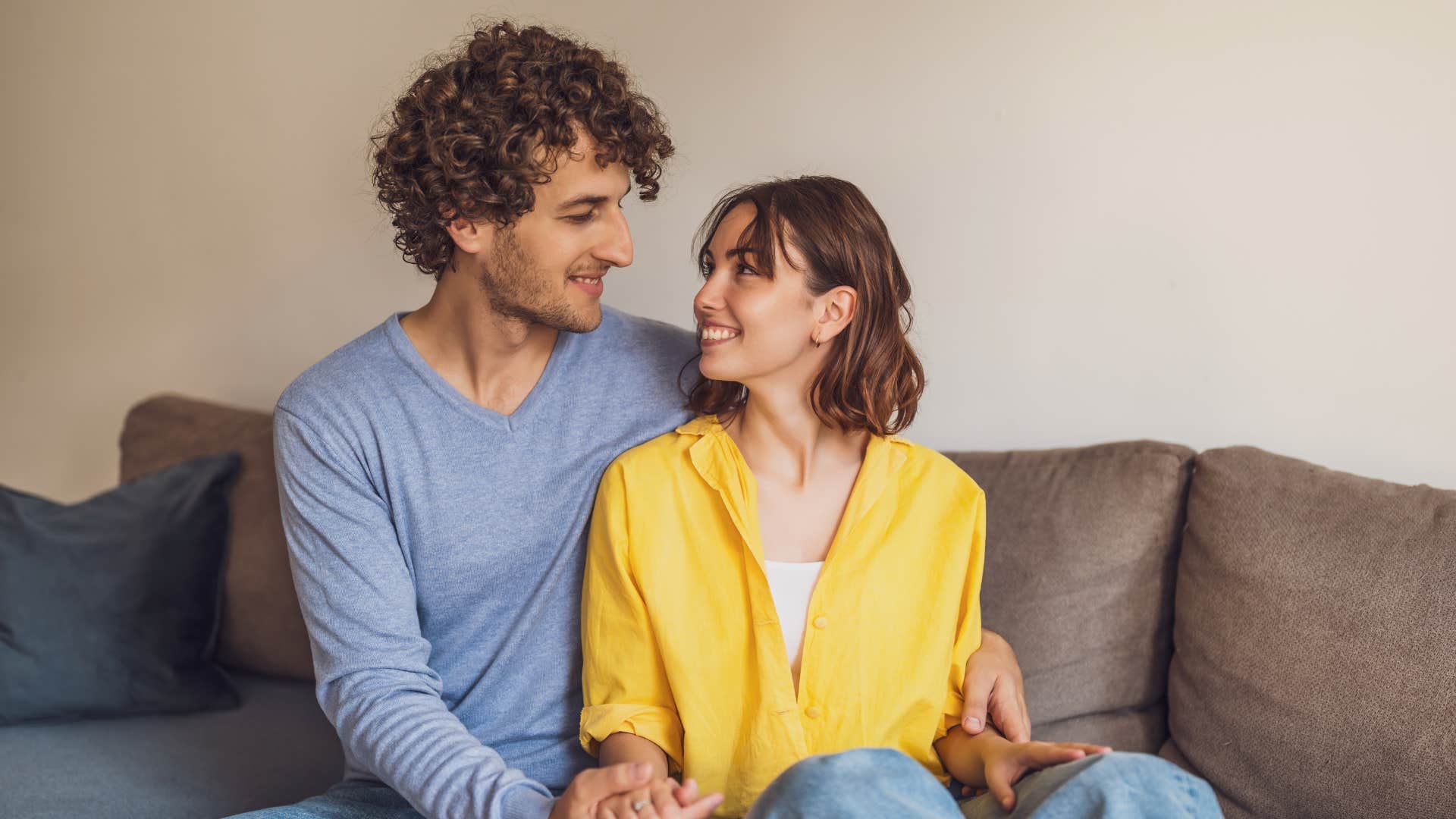 couple who spiritually connect still hold hands at the grocery store