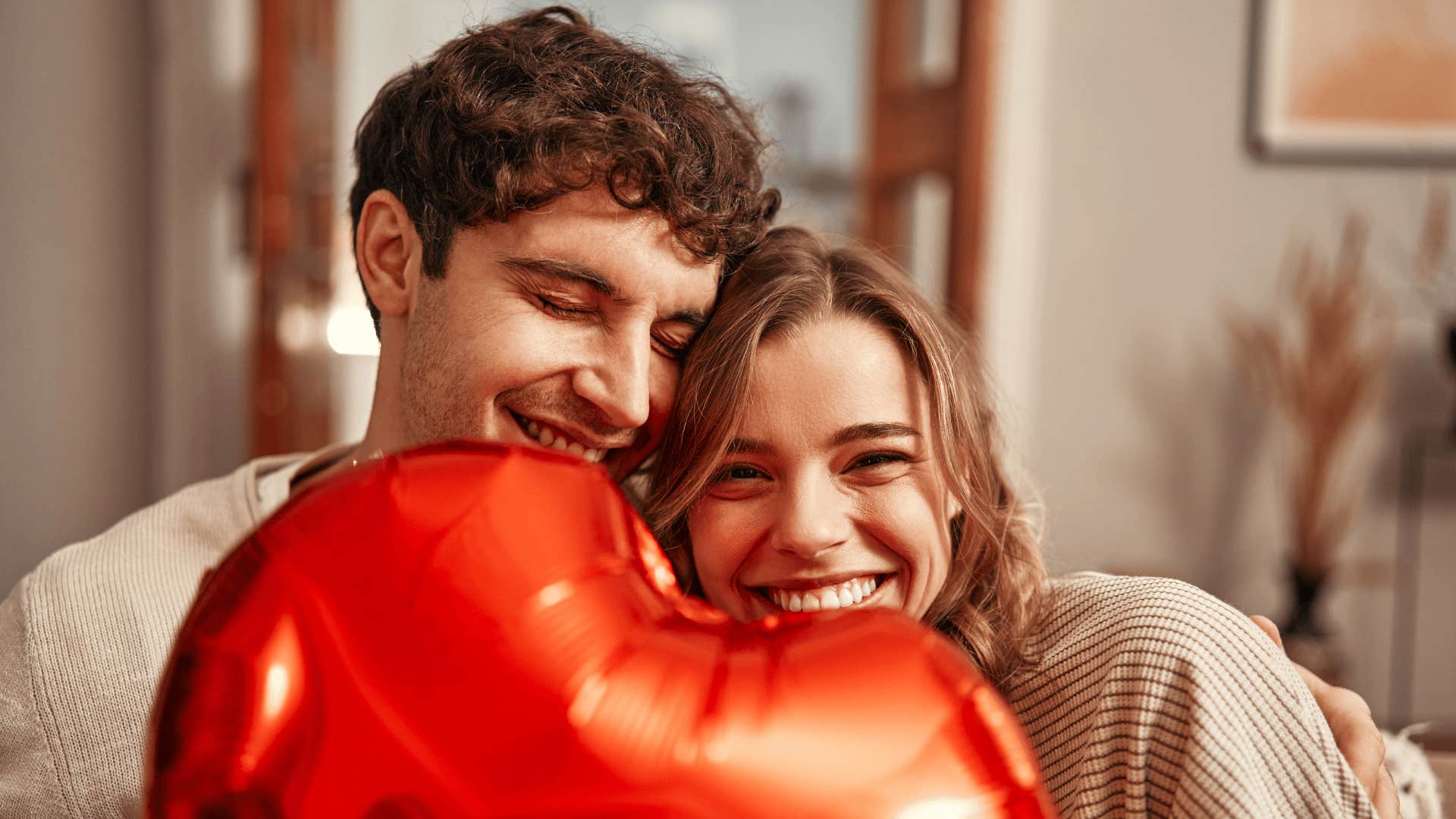 smiling emotionally in sync couple