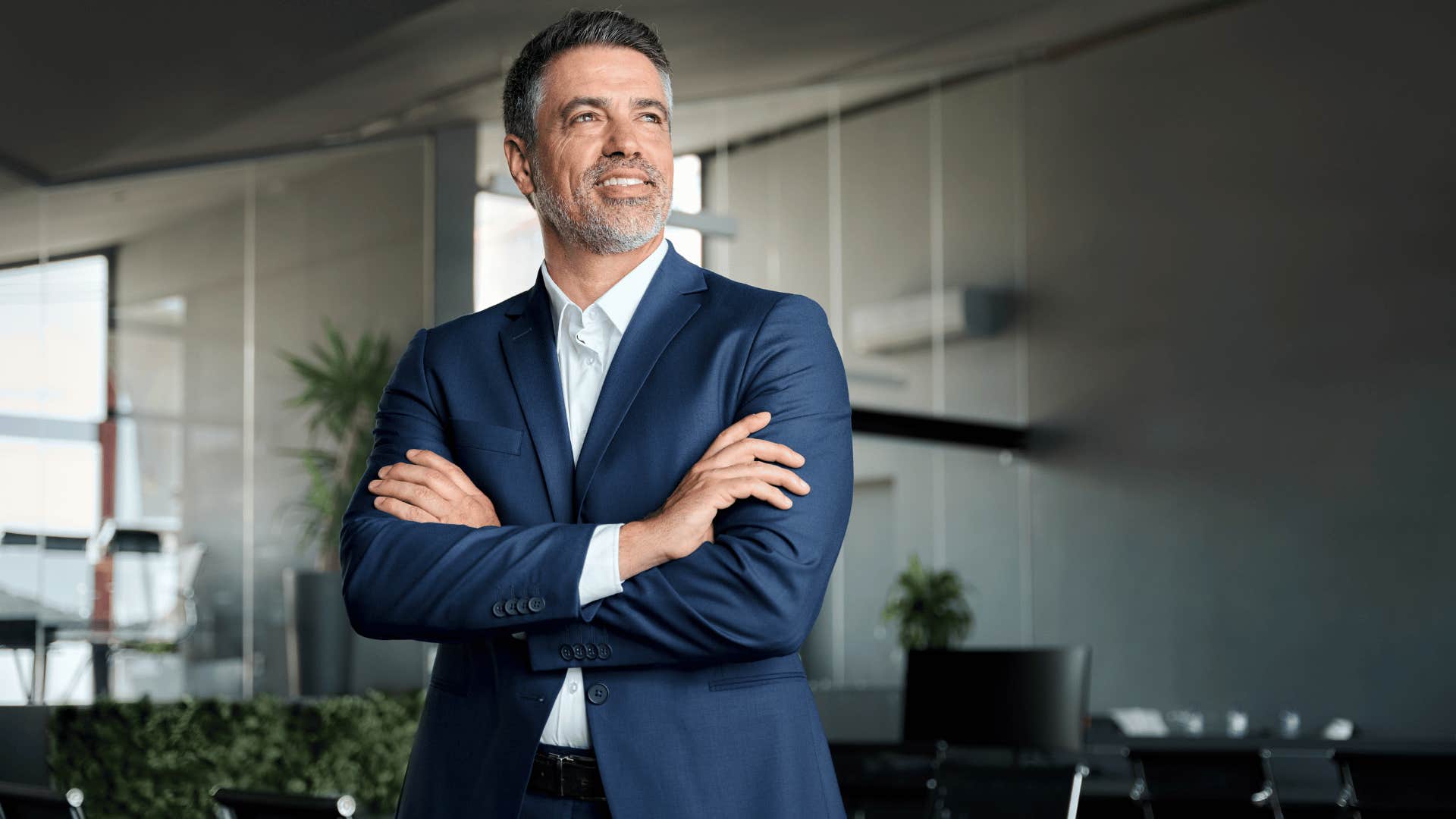 man in suit who's not someone's other half crossing arms and smiling 