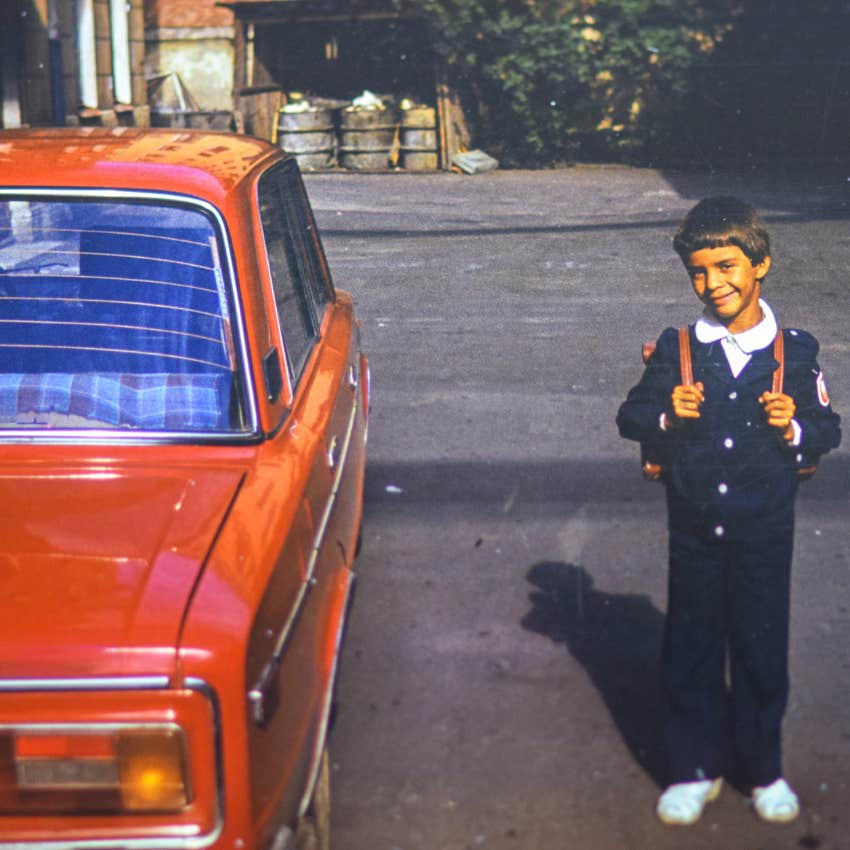 gen-x child next to car