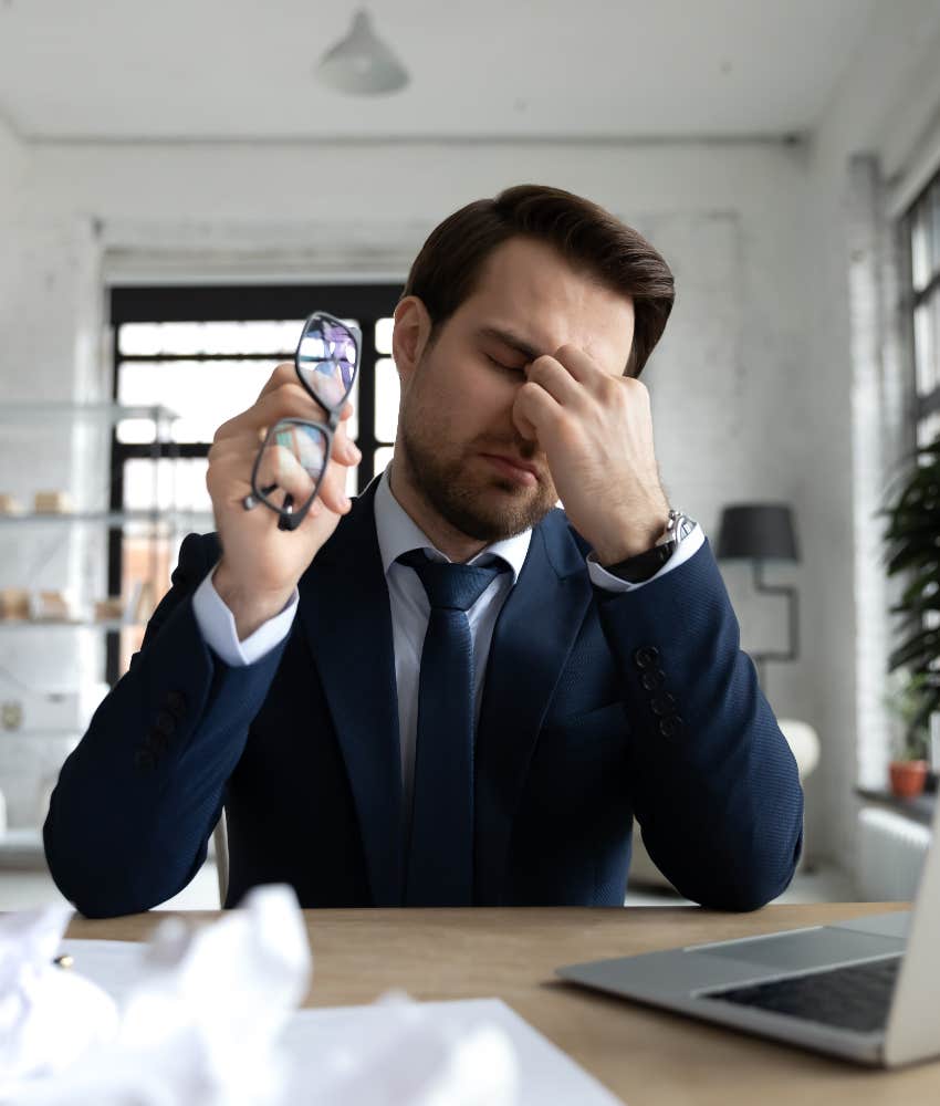 drained worker pretends to care at his job