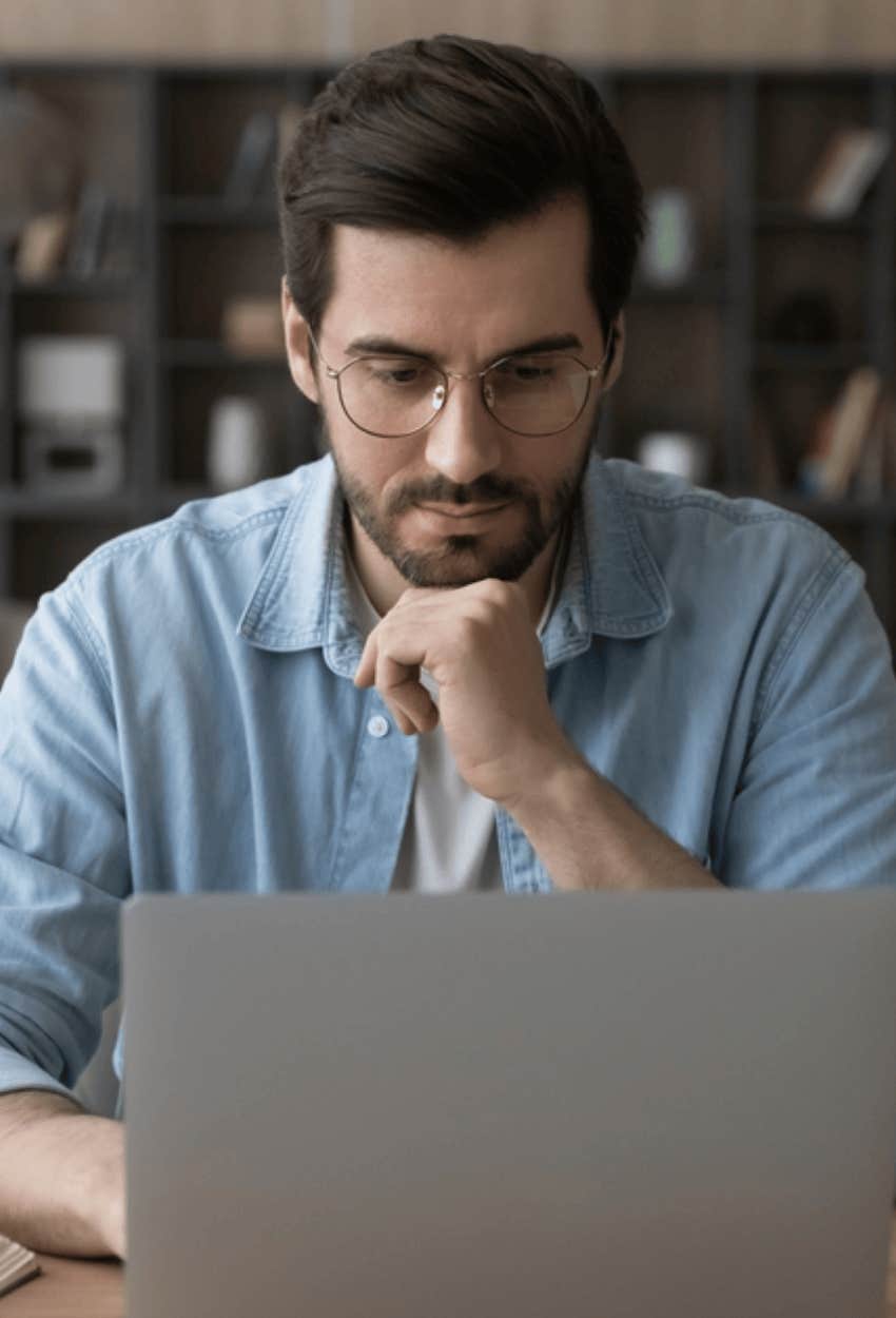 man reading his emails in the morning