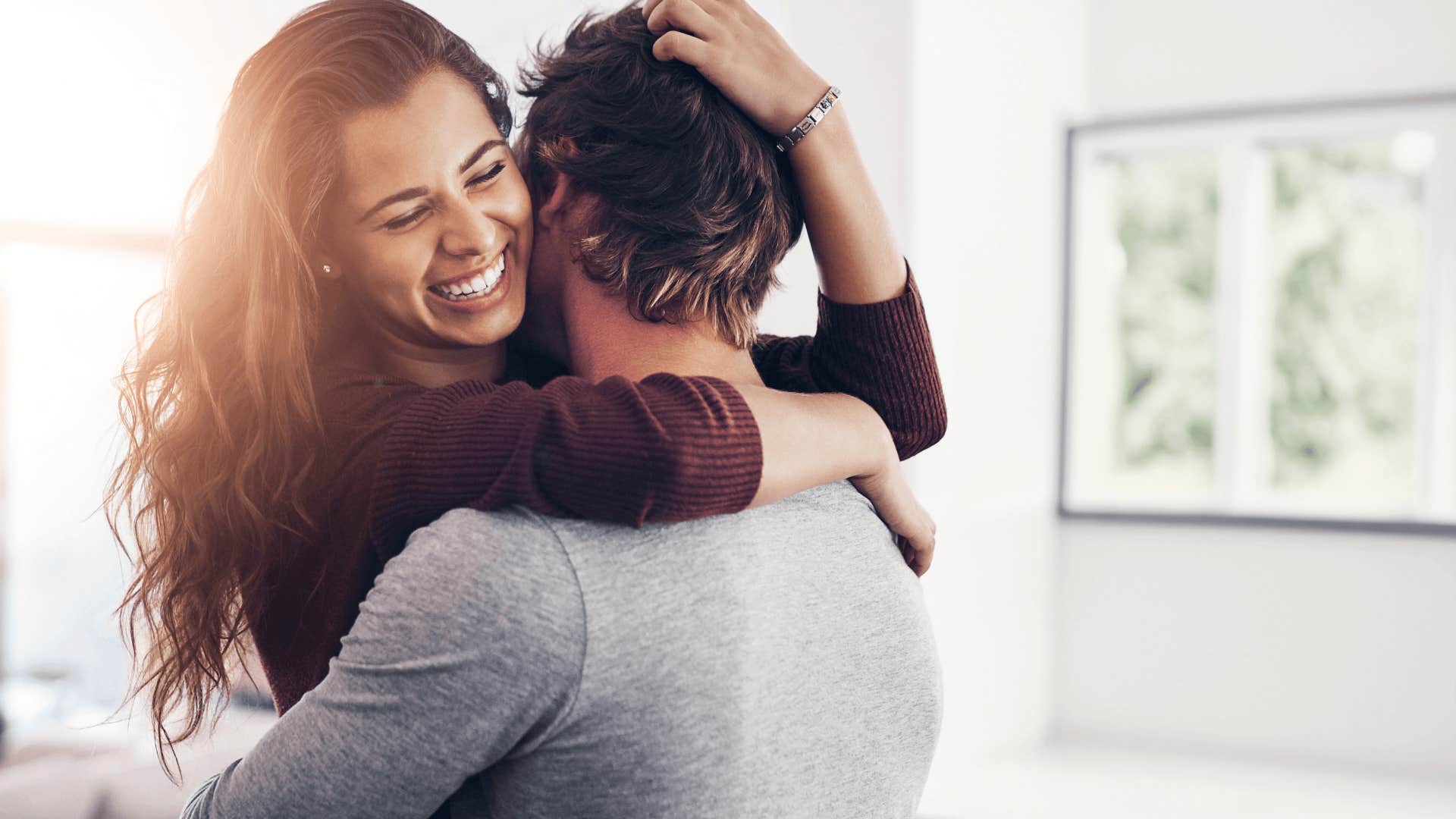 woman hugging man who has emotional needs in relationship