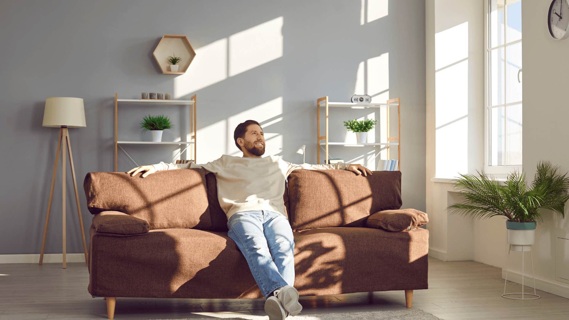 smiling man alone with emotional needs in his relationship