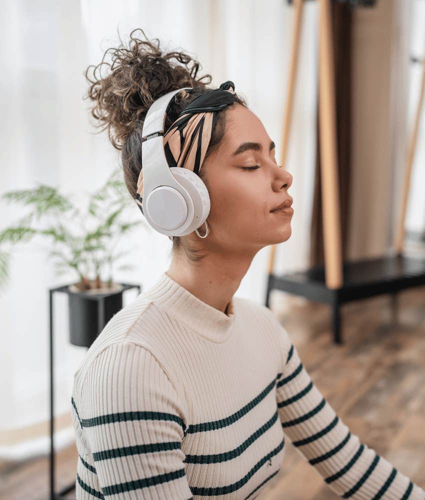 Woman listens to music and her feelings to deal with heartache