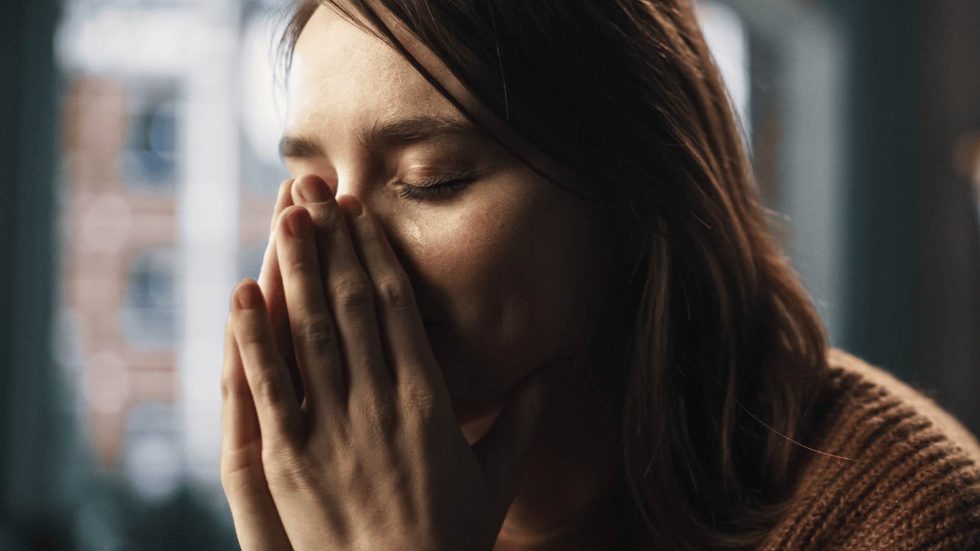 Upset woman who grew up in dysfunctional home believing she's unattractive