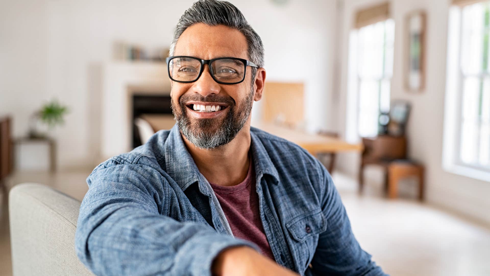 man smiling after spending more time at home