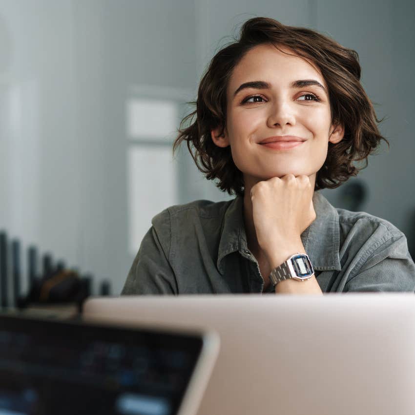 gen-z woman happy at laptop