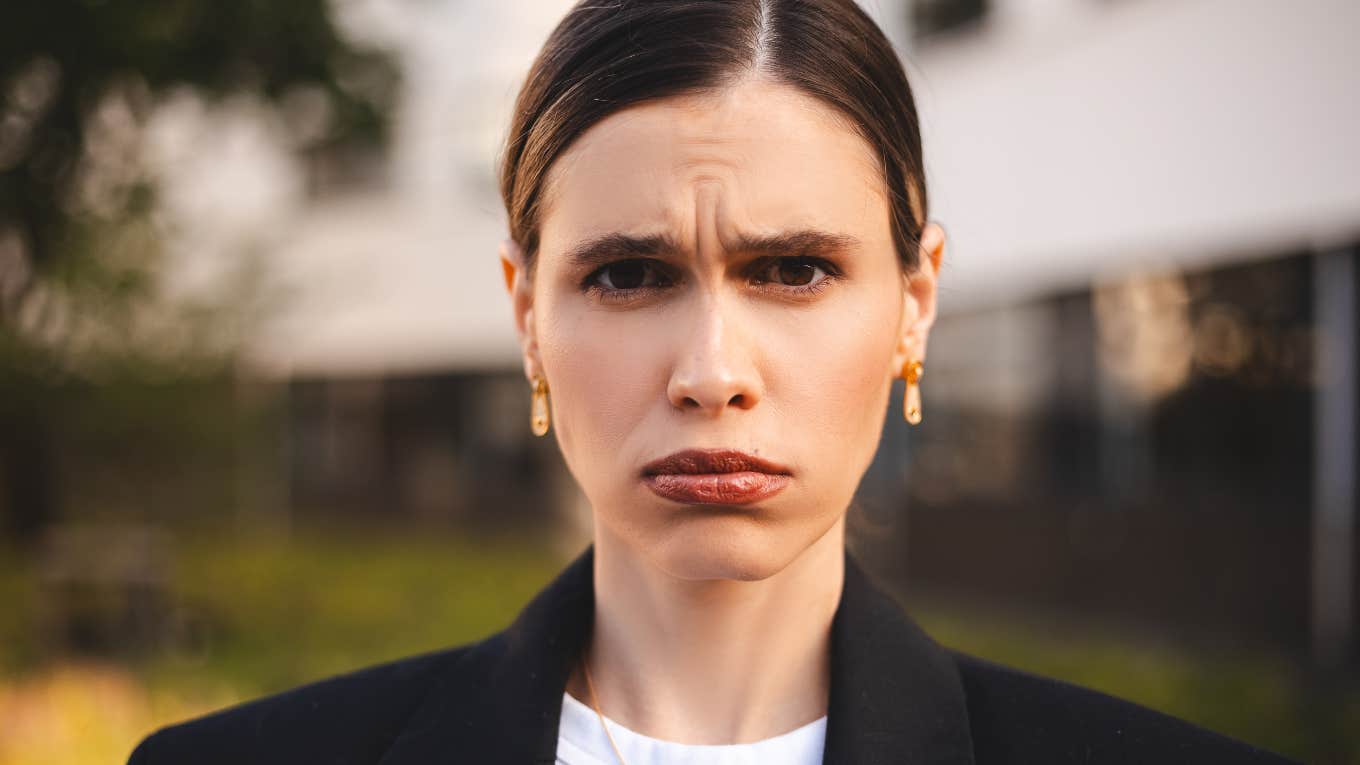 Glaring Signs Of An Entitled Adult Child, Despite Their Parents' Best Efforts entitled adult woman with a pout on her face
